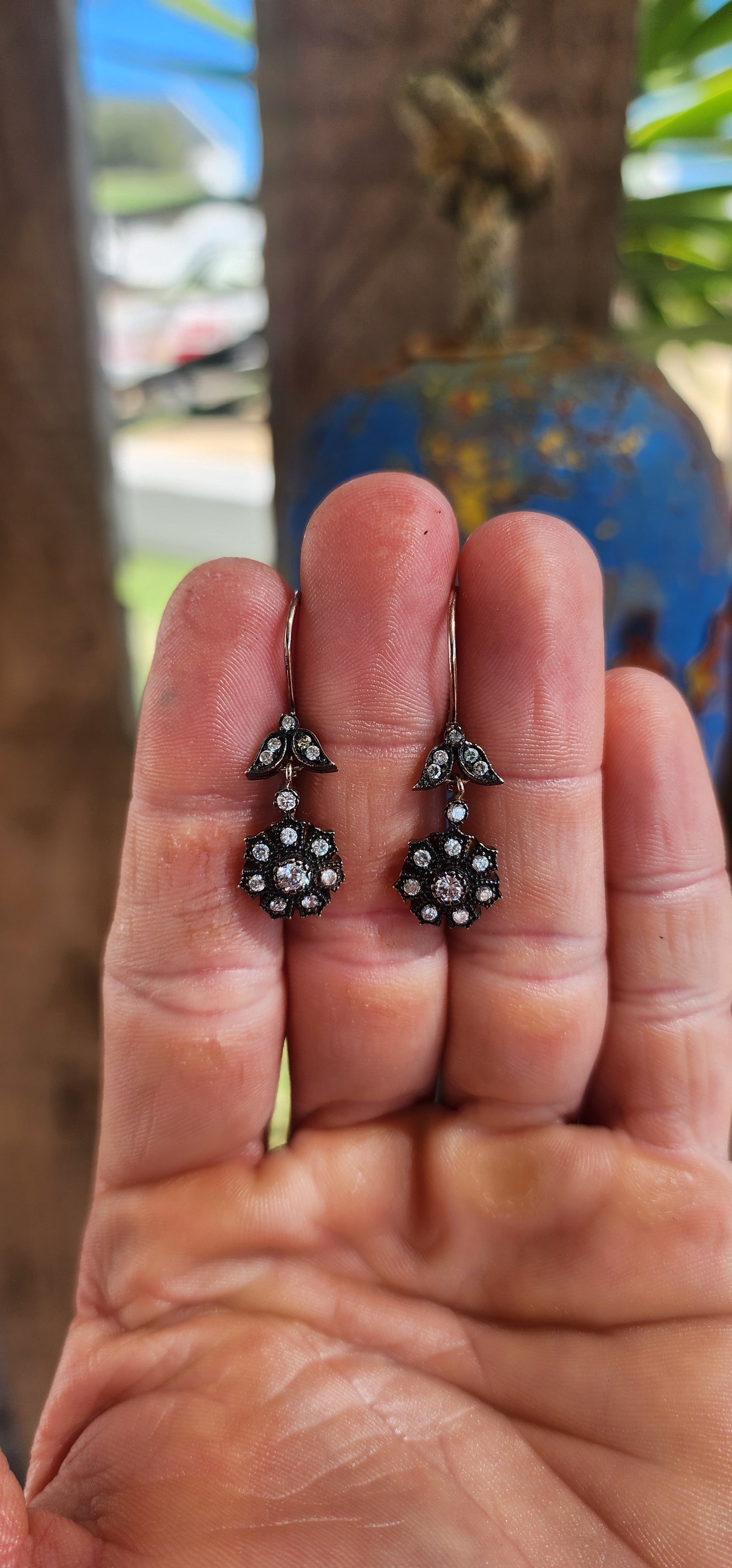 These elegant earrings are crafted in sterling silver and display a refined Victorian revival design that captures the romantic spirit of 19th-century jewelry.