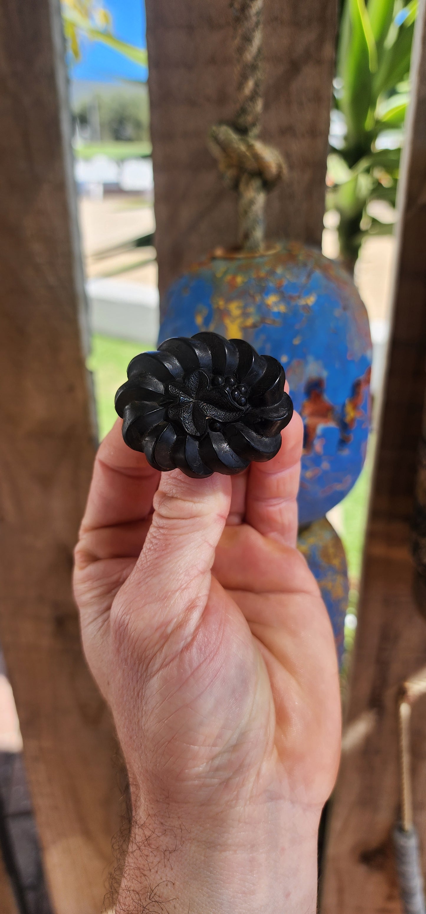This is a rare antique Victorian mourning brooch, hand-carved from Irish bog oak, dating to the late 19th century, circa 1880s.