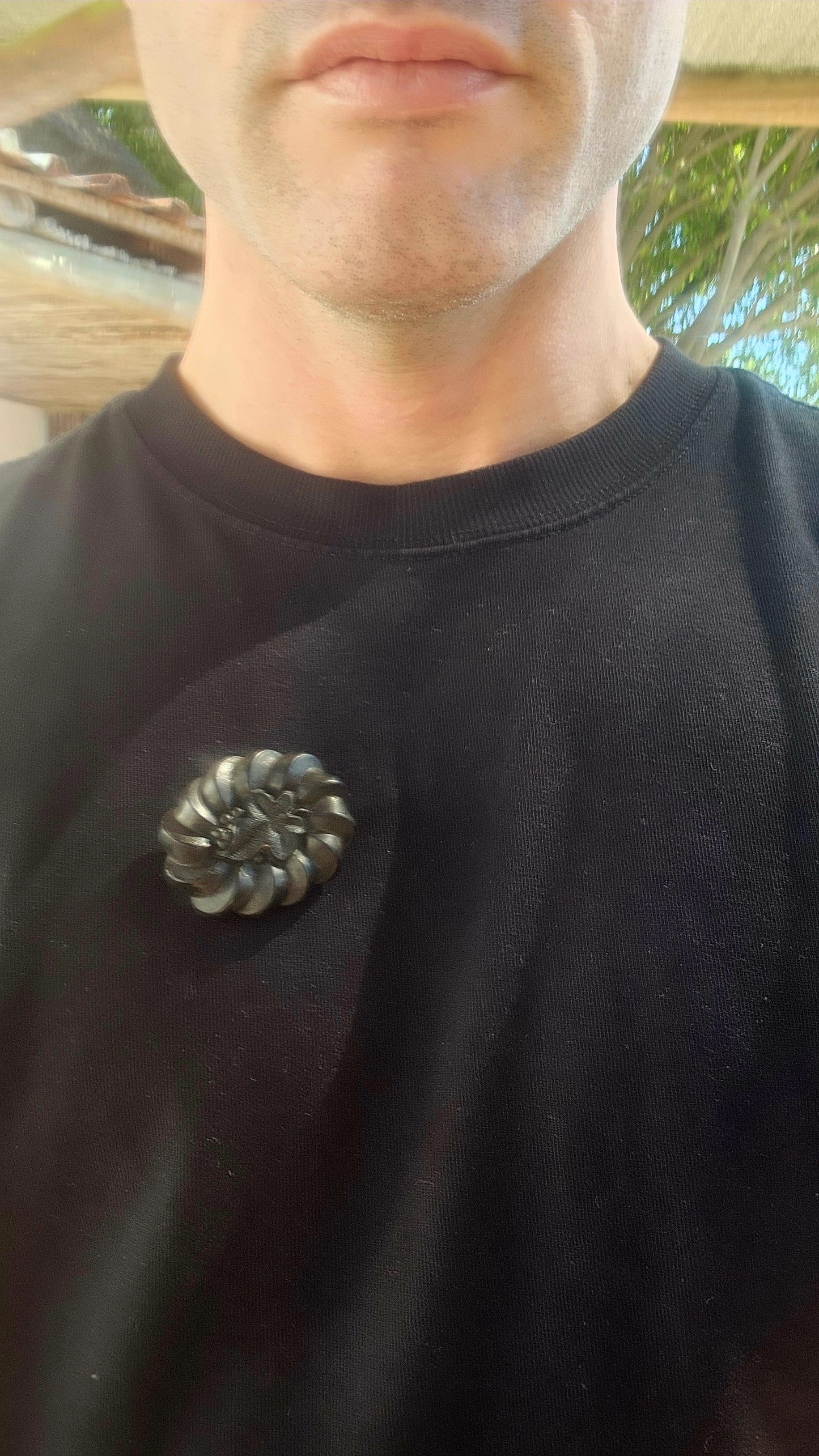 This is a rare antique Victorian mourning brooch, hand-carved from Irish bog oak, dating to the late 19th century, circa 1880s.