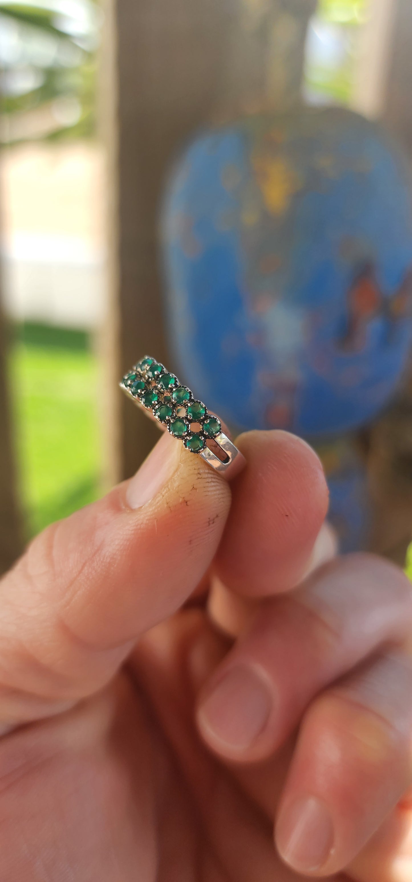 This sterling silver half-eternity ring breathes fresh, verdant energy , set with not one but two shimmering rows of round-cut green chalcedony gemstones.