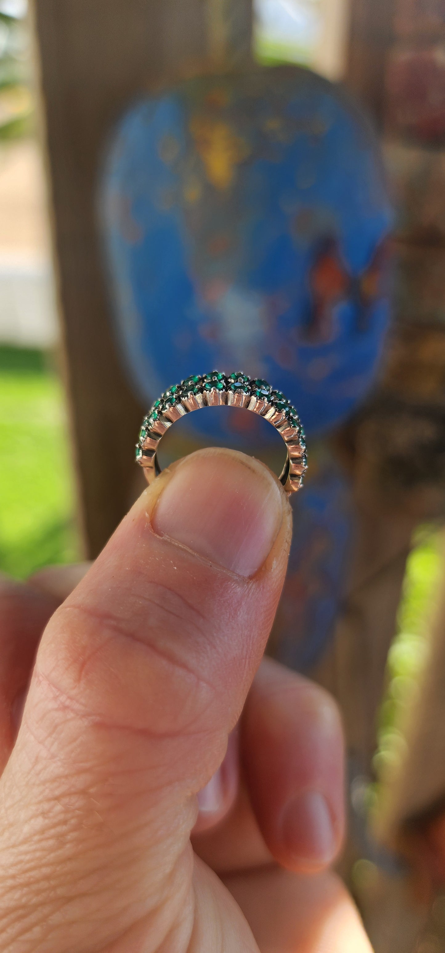 This sterling silver half-eternity ring breathes fresh, verdant energy , set with not one but two shimmering rows of round-cut green chalcedony gemstones.
