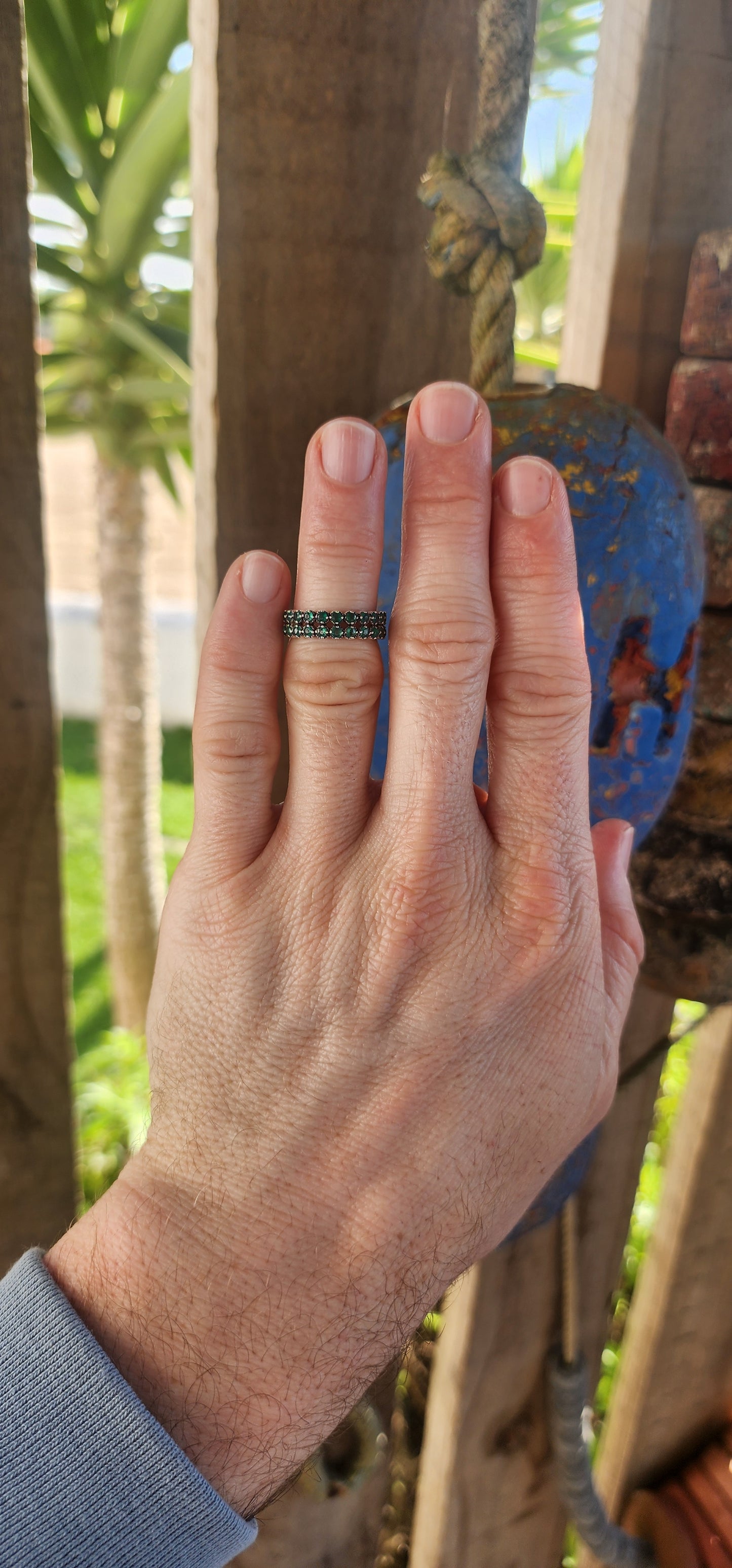 This sterling silver half-eternity ring breathes fresh, verdant energy , set with not one but two shimmering rows of round-cut green chalcedony gemstones.