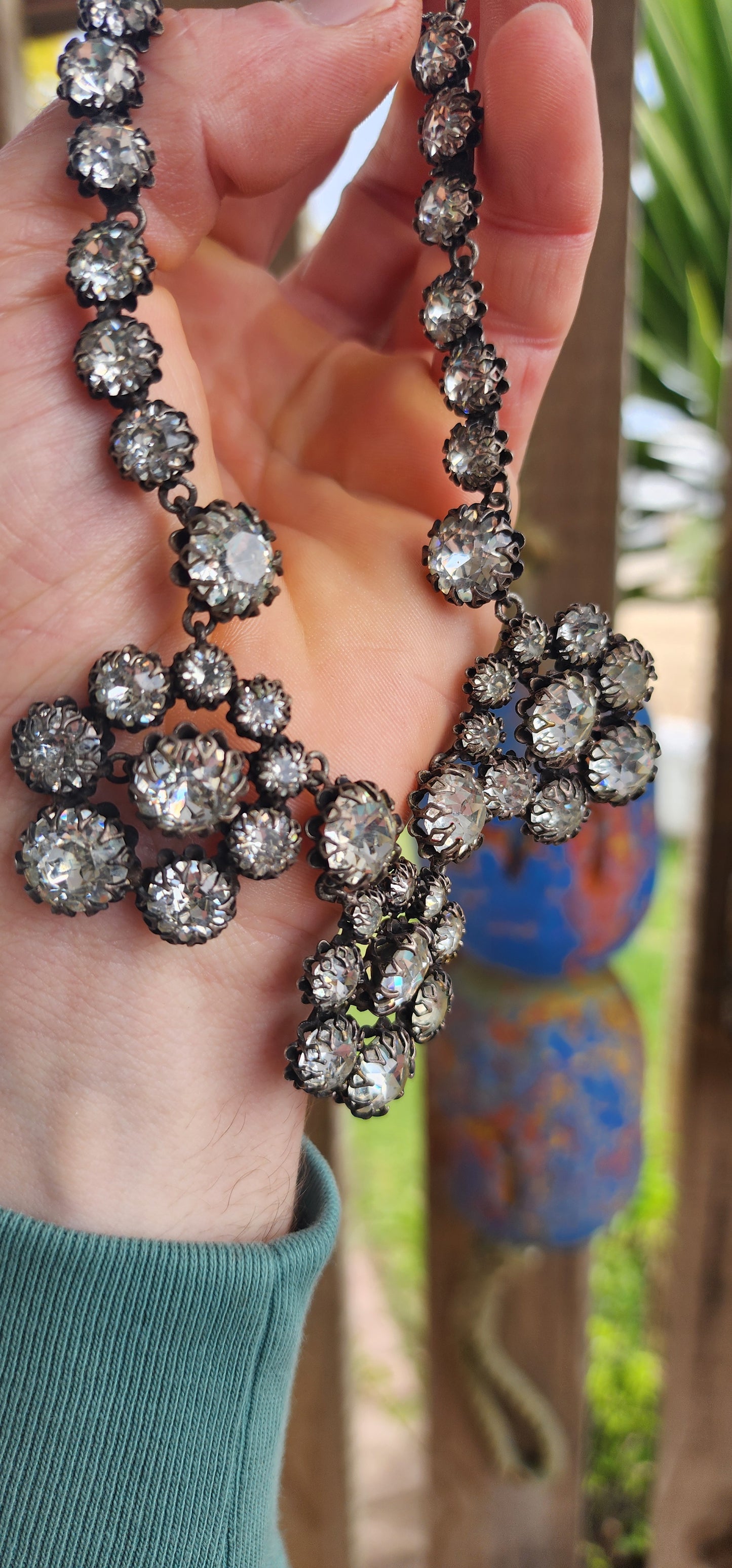This spectacular and chunky 1960s French vintage costume choker necklace is a showstopper from every angle! Expertly crafted in silvertone metal, the entire necklace is encrusted with sparkly clear foiled-back paste glass rhinestones.