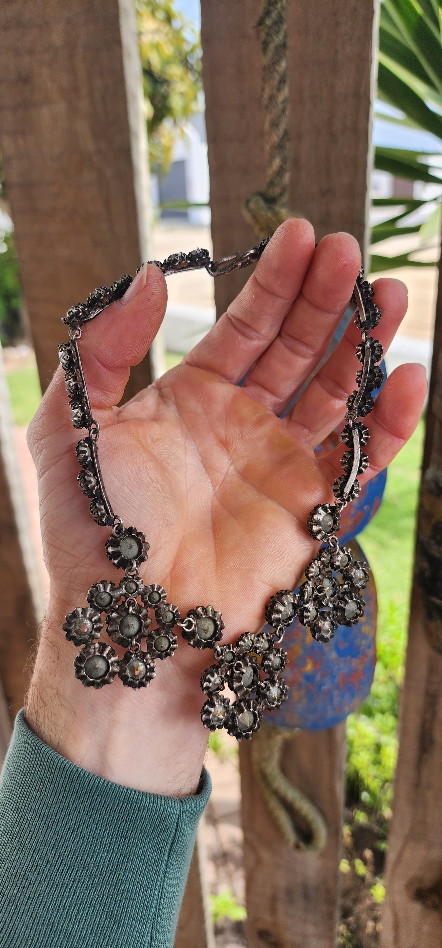 This spectacular and chunky 1960s French vintage costume choker necklace is a showstopper from every angle! Expertly crafted in silvertone metal, the entire necklace is encrusted with sparkly clear foiled-back paste glass rhinestones.