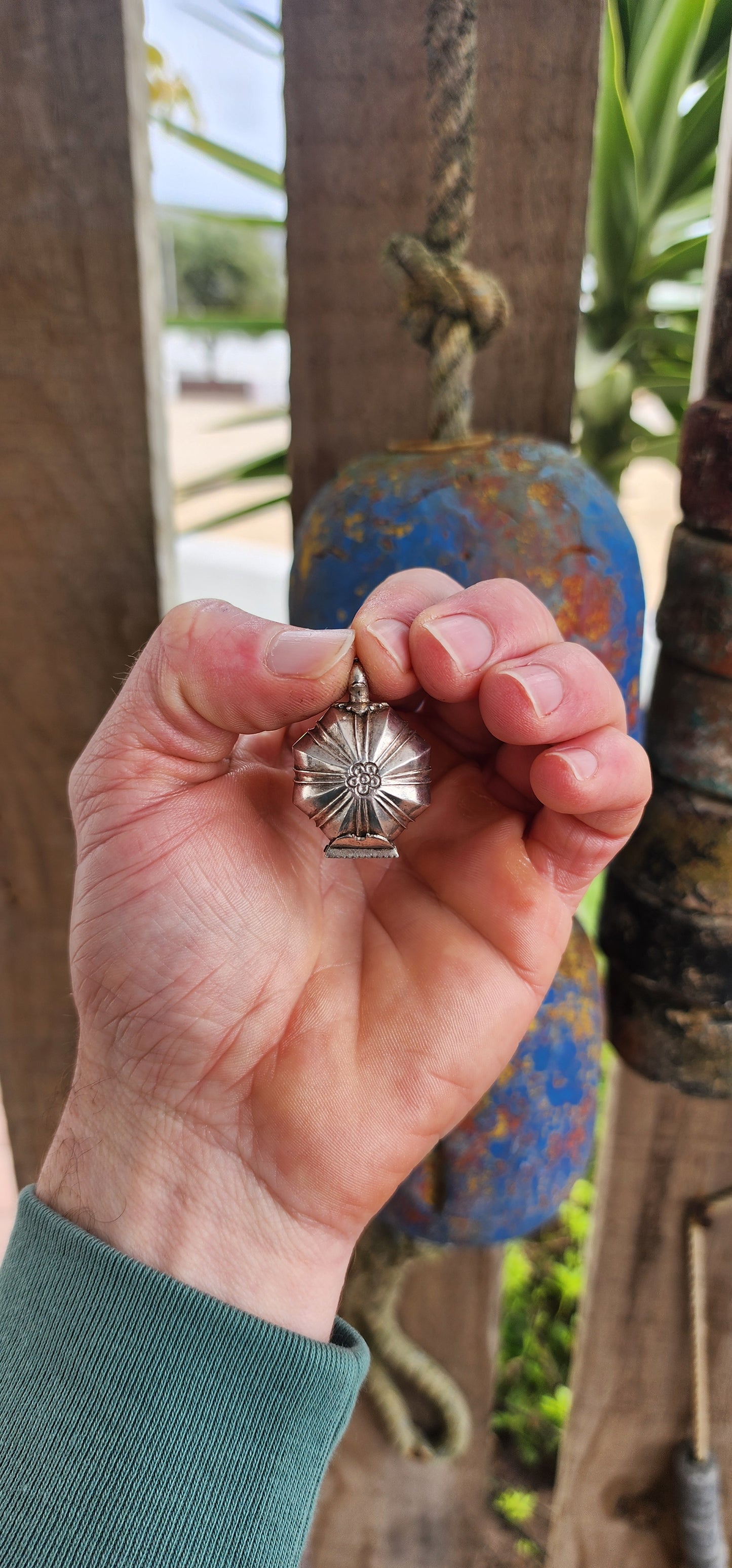 This marvelous and unusual antique sterling silver locket comes from Sri Lanka and is steeped in rich cultural tradition. Crafted in a bold hexagonal form, it is designed as a hinged container once used to hold betel and lime paste.