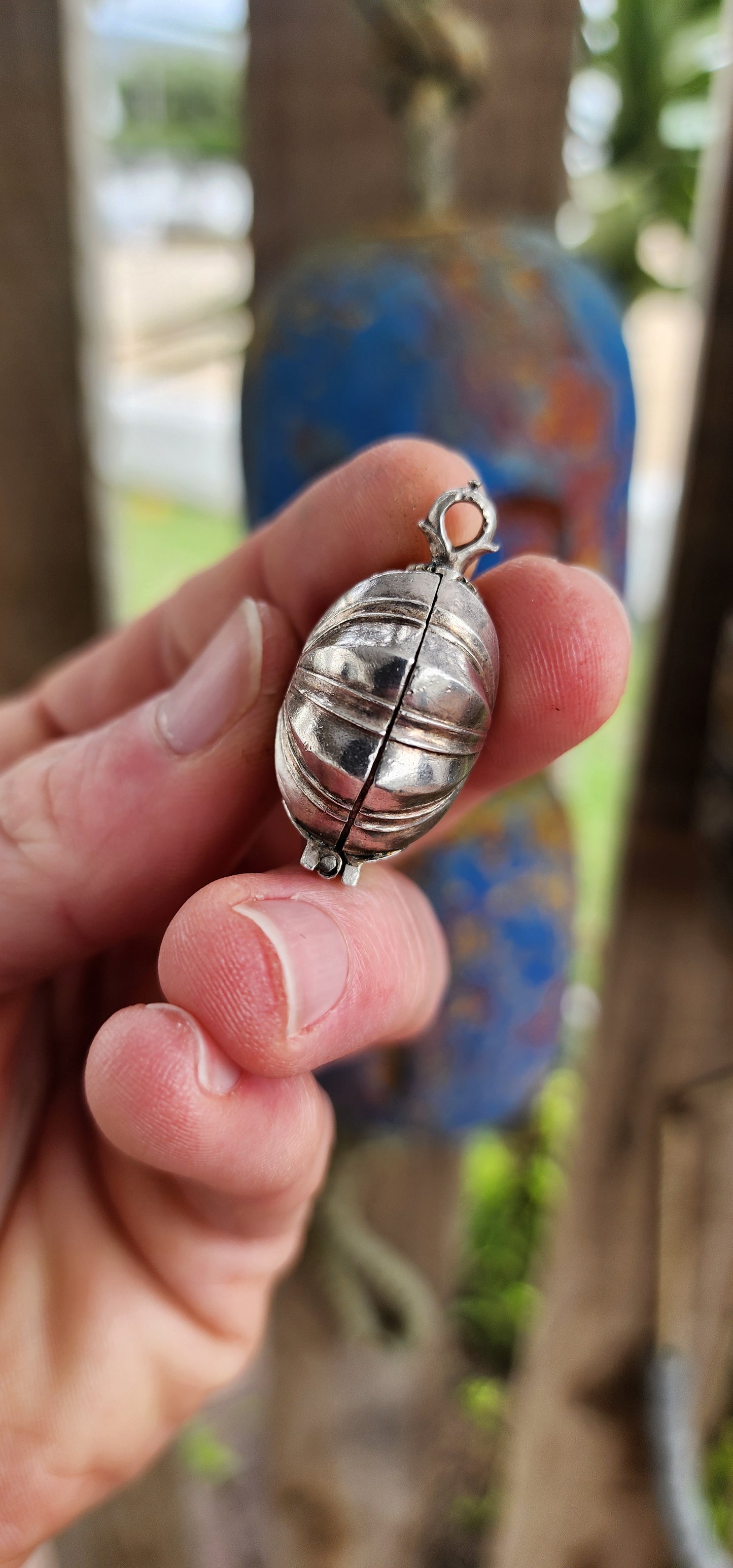 This marvelous and unusual antique sterling silver locket comes from Sri Lanka and is steeped in rich cultural tradition. Crafted in a bold hexagonal form, it is designed as a hinged container once used to hold betel and lime paste.