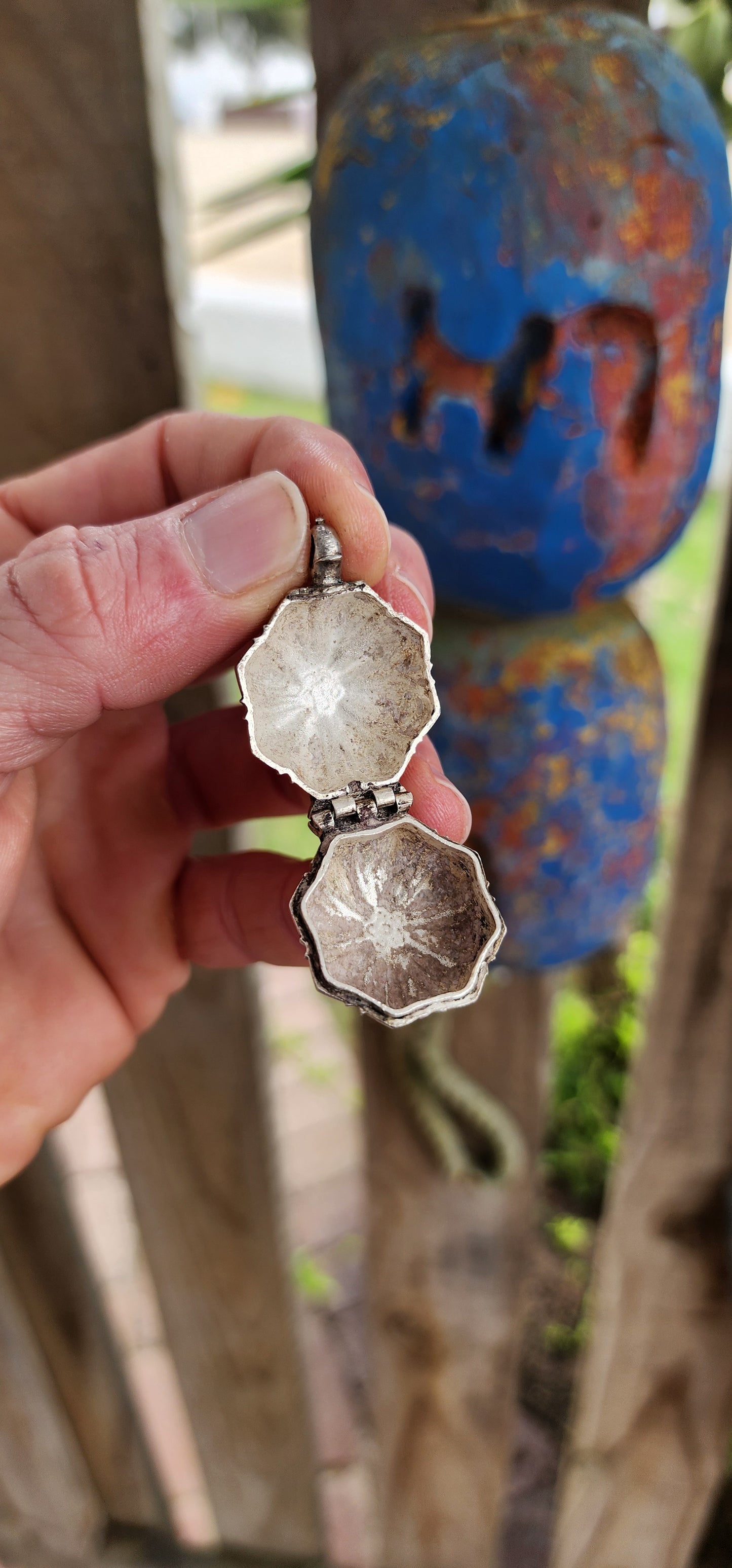 This marvelous and unusual antique sterling silver locket comes from Sri Lanka and is steeped in rich cultural tradition. Crafted in a bold hexagonal form, it is designed as a hinged container once used to hold betel and lime paste.
