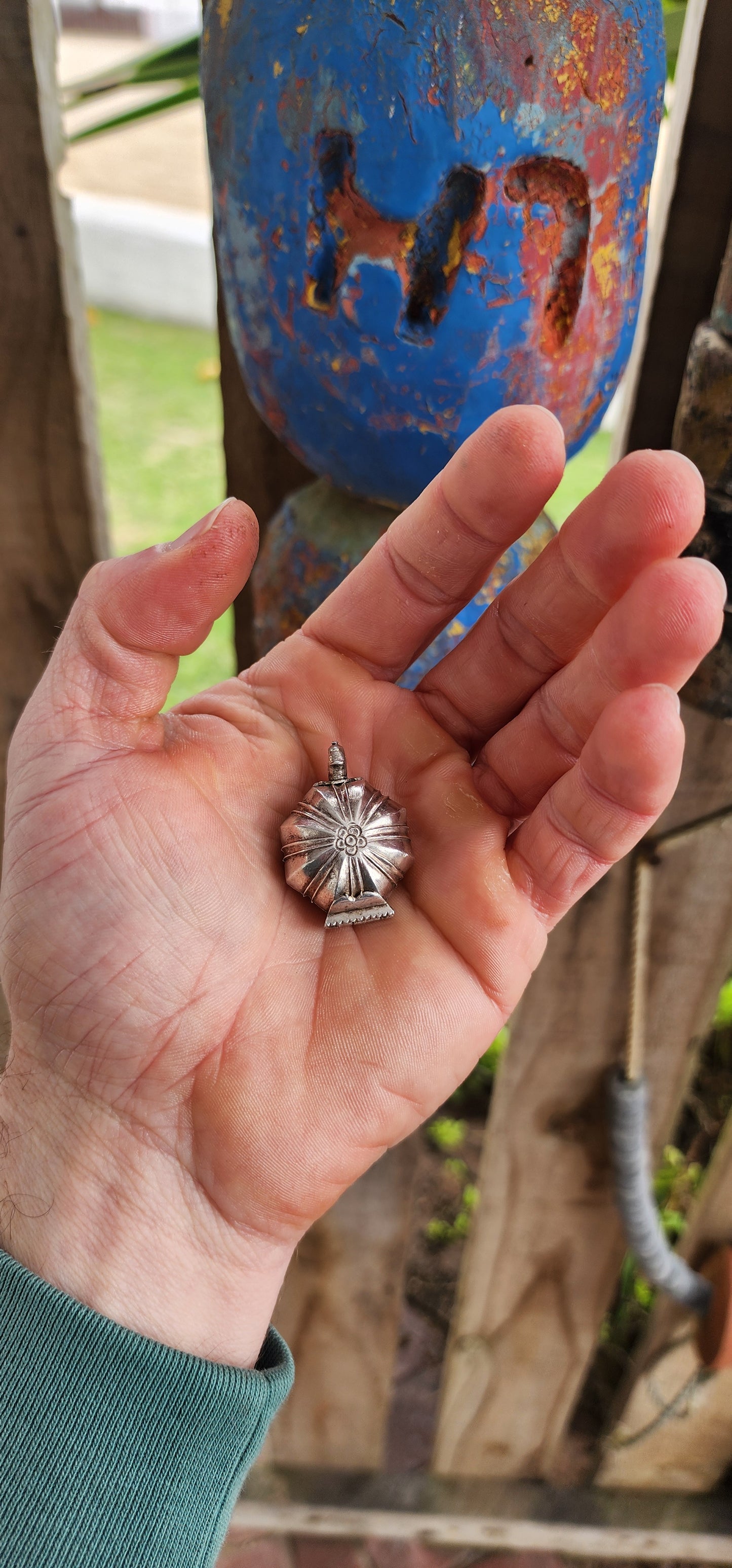 This marvelous and unusual antique sterling silver locket comes from Sri Lanka and is steeped in rich cultural tradition. Crafted in a bold hexagonal form, it is designed as a hinged container once used to hold betel and lime paste.