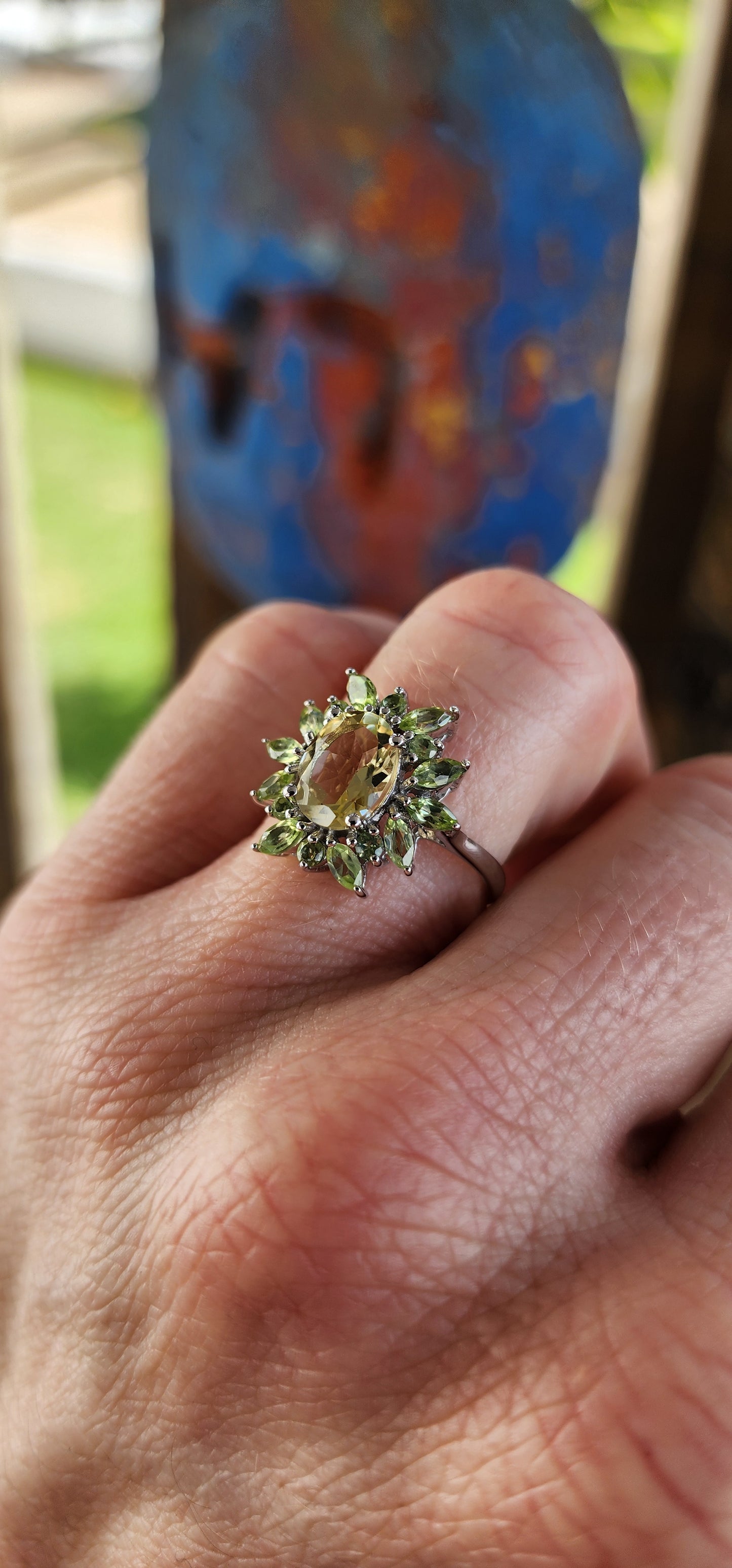 A Bloom of Citrus Light.
This enchanting cluster ring is a true celebration of springtime elegance, meticulously crafted in sterling silver and finished with a radiant rhodium plating for everlasting shine.