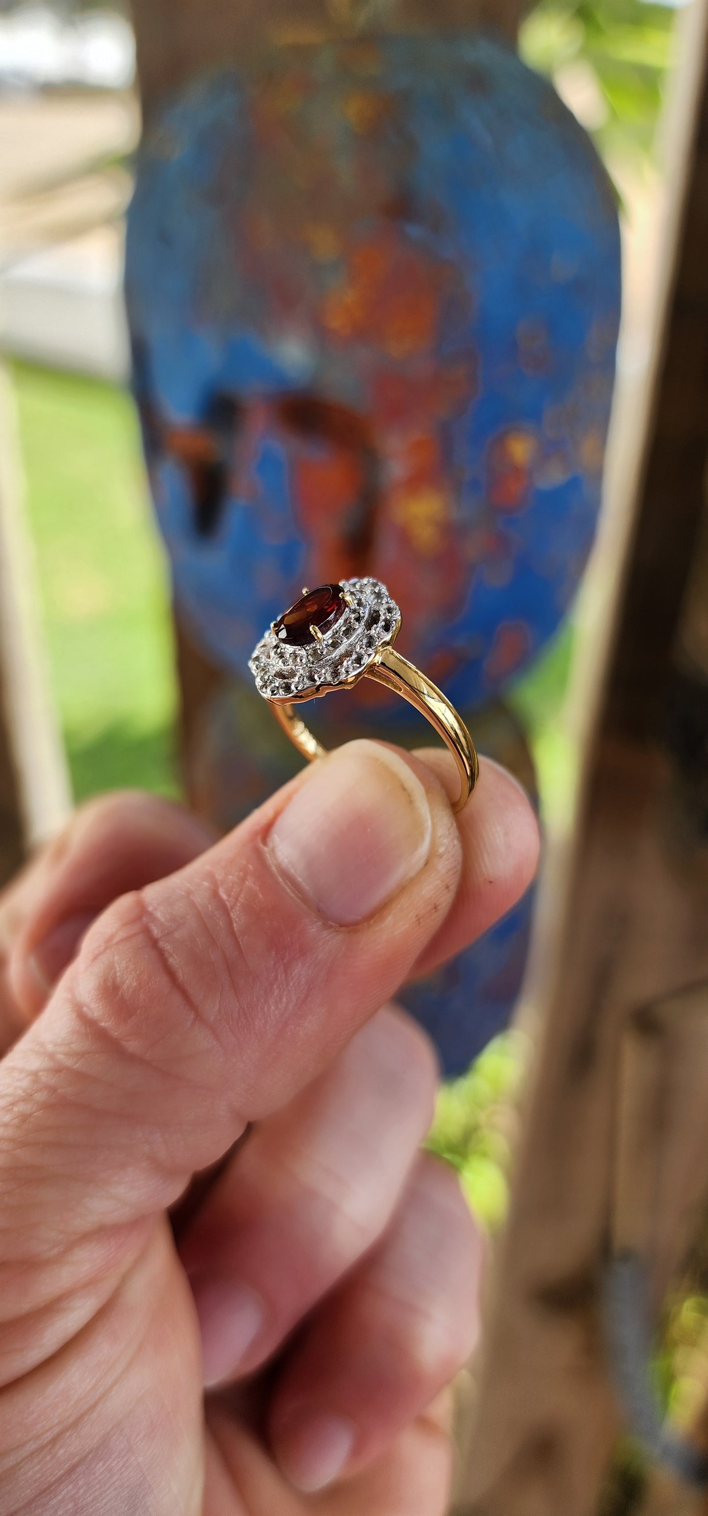 This enchanting vintage style halo ring is expertly crafted in sterling silver and luxuriously finished with a warm layer of 18ct yellow gold plating that lends it a rich and regal glow.