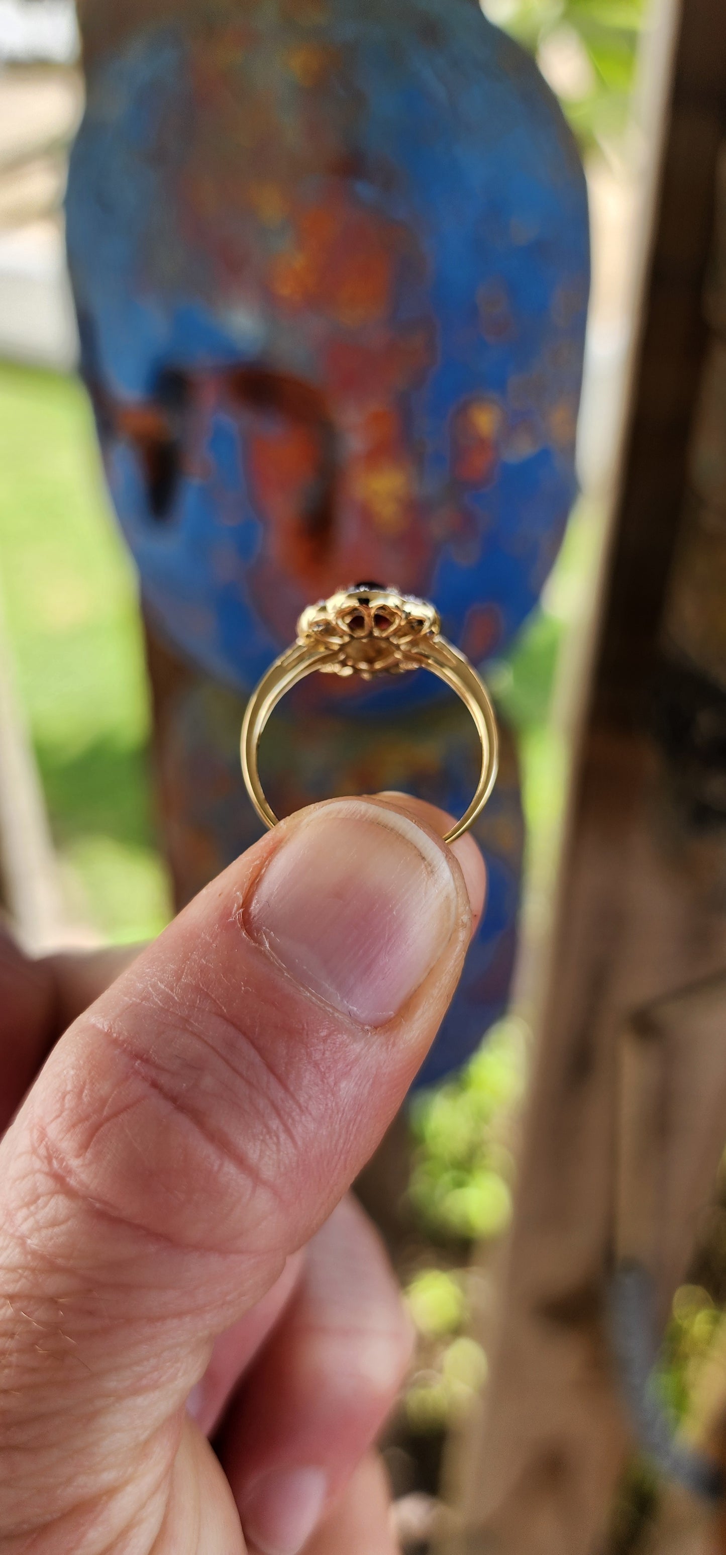 This enchanting vintage style halo ring is expertly crafted in sterling silver and luxuriously finished with a warm layer of 18ct yellow gold plating that lends it a rich and regal glow.
