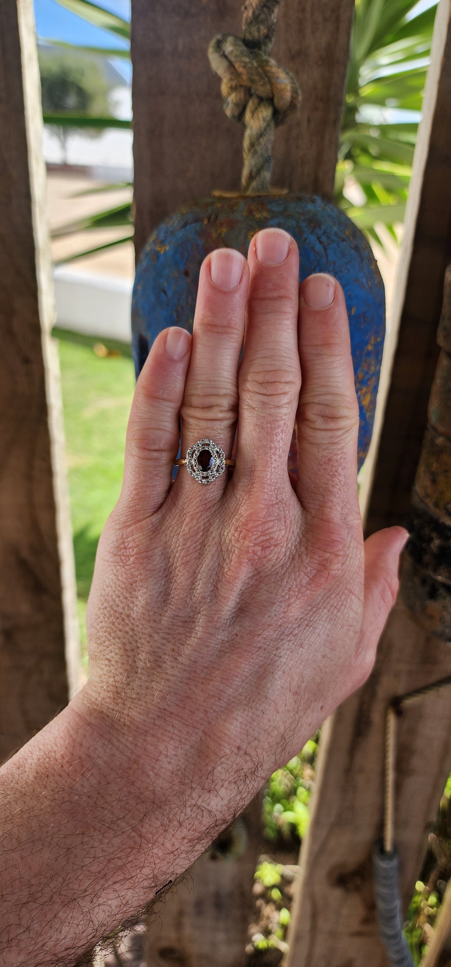 This enchanting vintage style halo ring is expertly crafted in sterling silver and luxuriously finished with a warm layer of 18ct yellow gold plating that lends it a rich and regal glow.