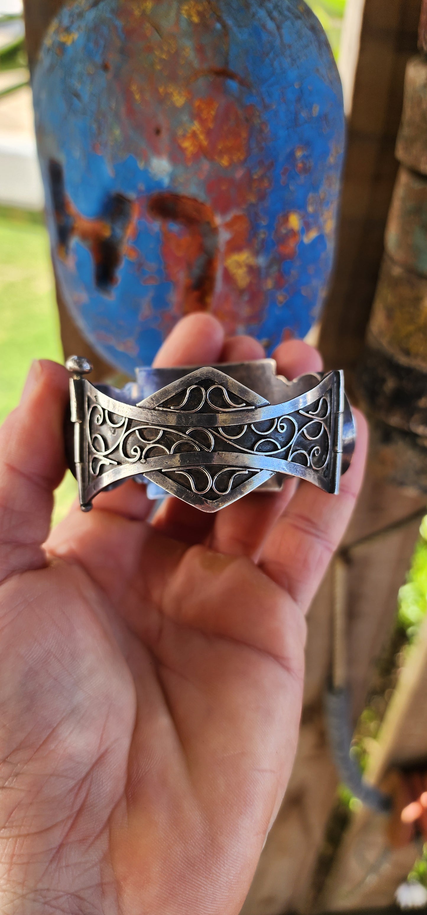 Striking antique hinged bangle, crafted in solid 800 silver with commanding presence and intricate artistry.