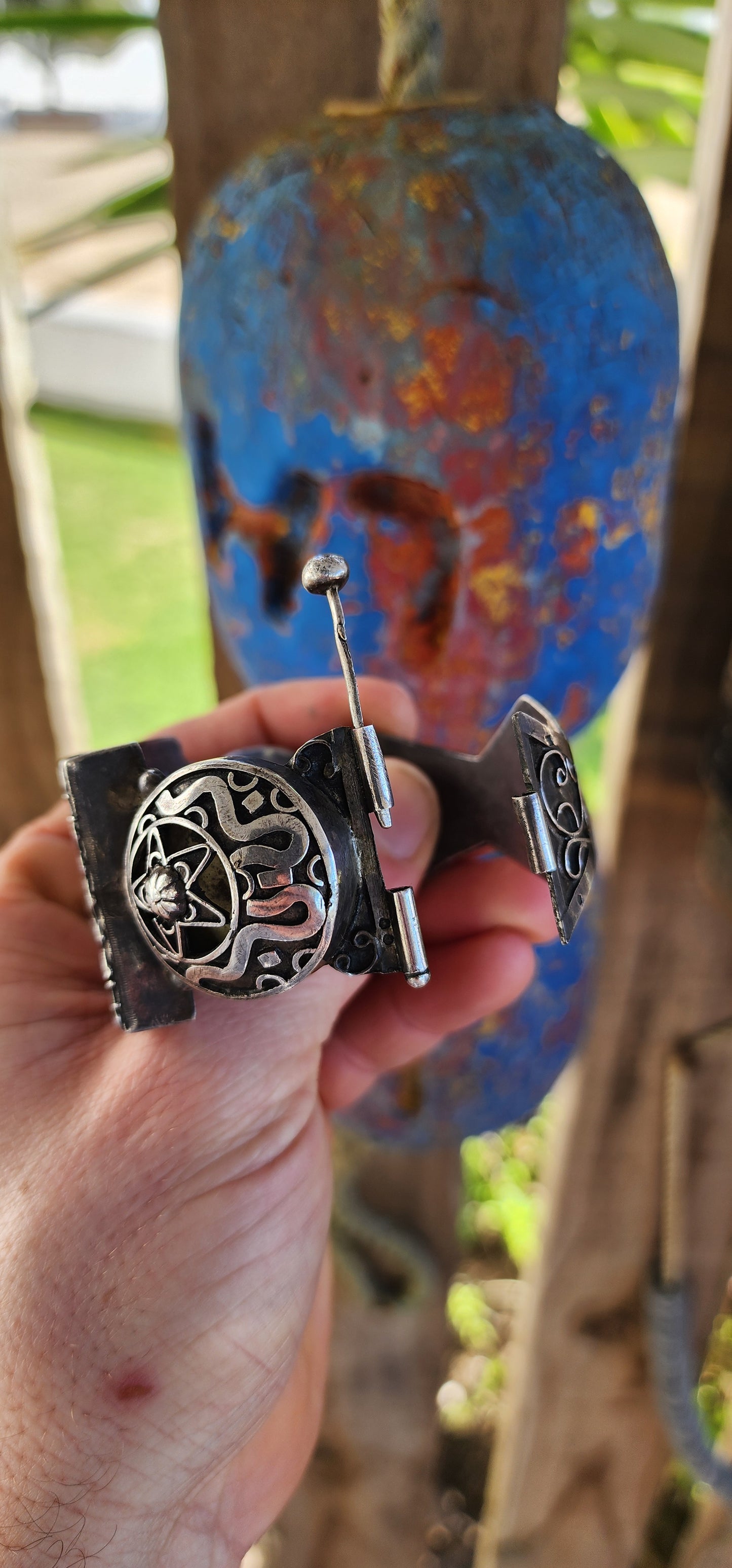 Striking antique hinged bangle, crafted in solid 800 silver with commanding presence and intricate artistry.