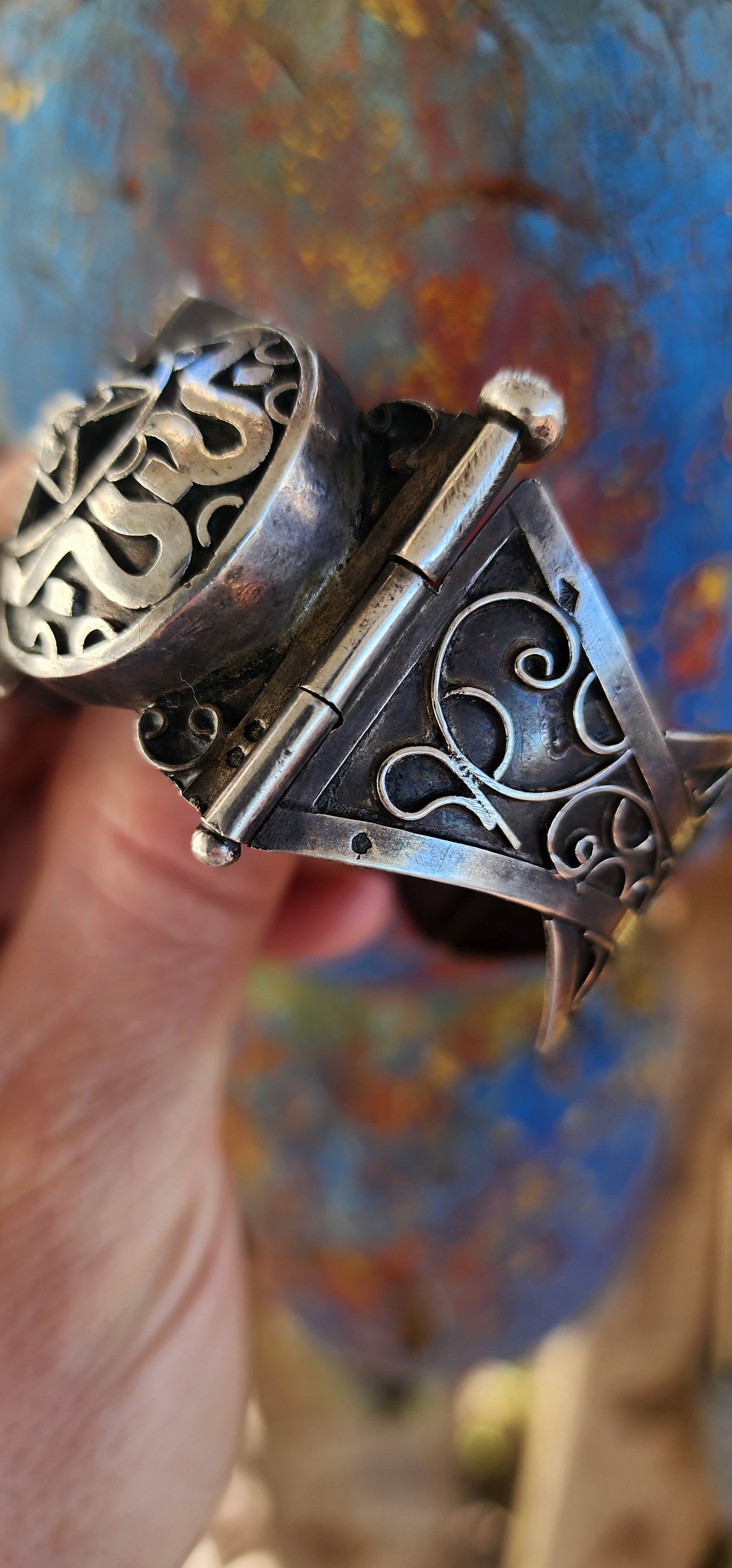 Striking antique hinged bangle, crafted in solid 800 silver with commanding presence and intricate artistry.