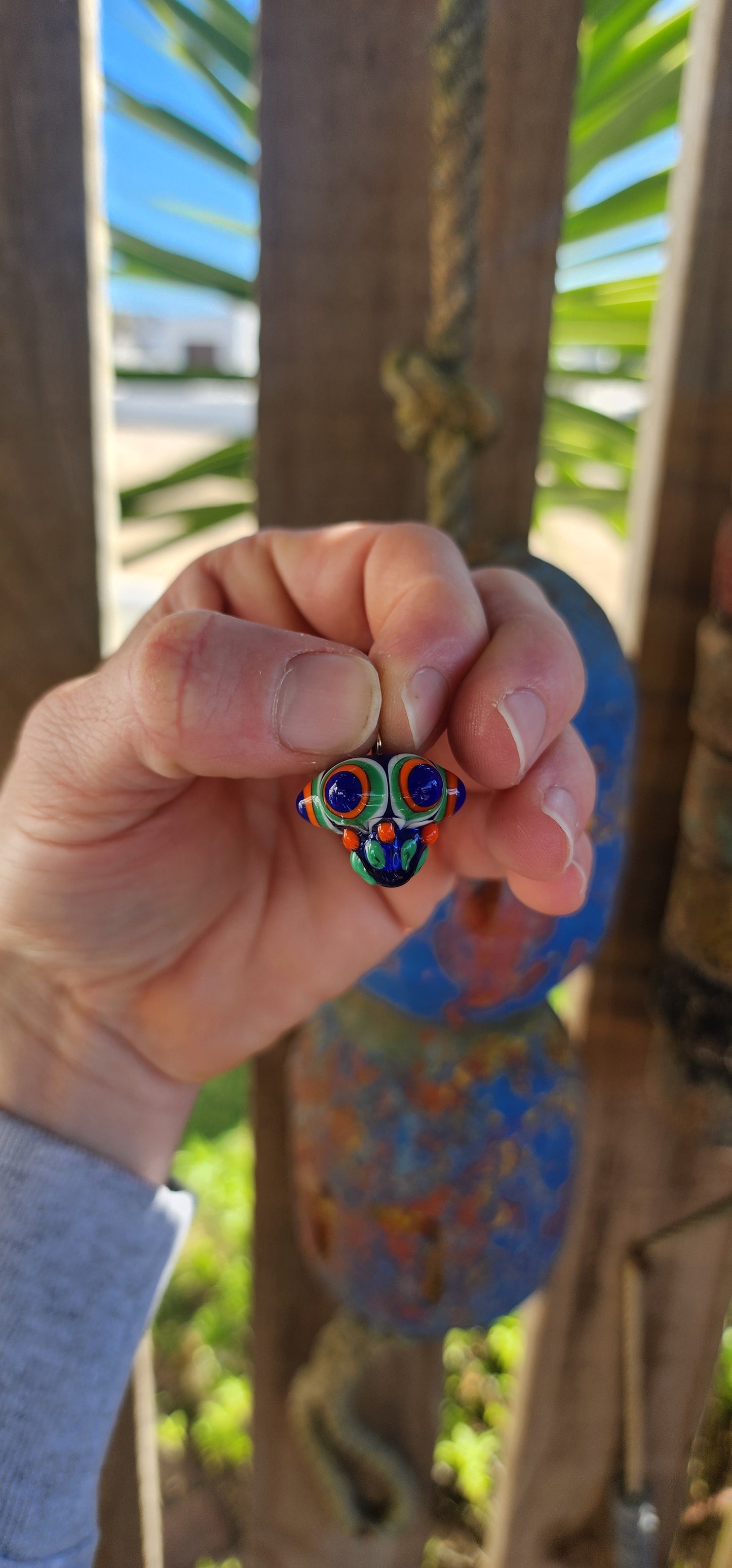A true burst of color and imagination! This unusual and funky artisan-made pendant has been crafted using the age-old lampwork glass technique, resulting in a miniature piece of wearable art.