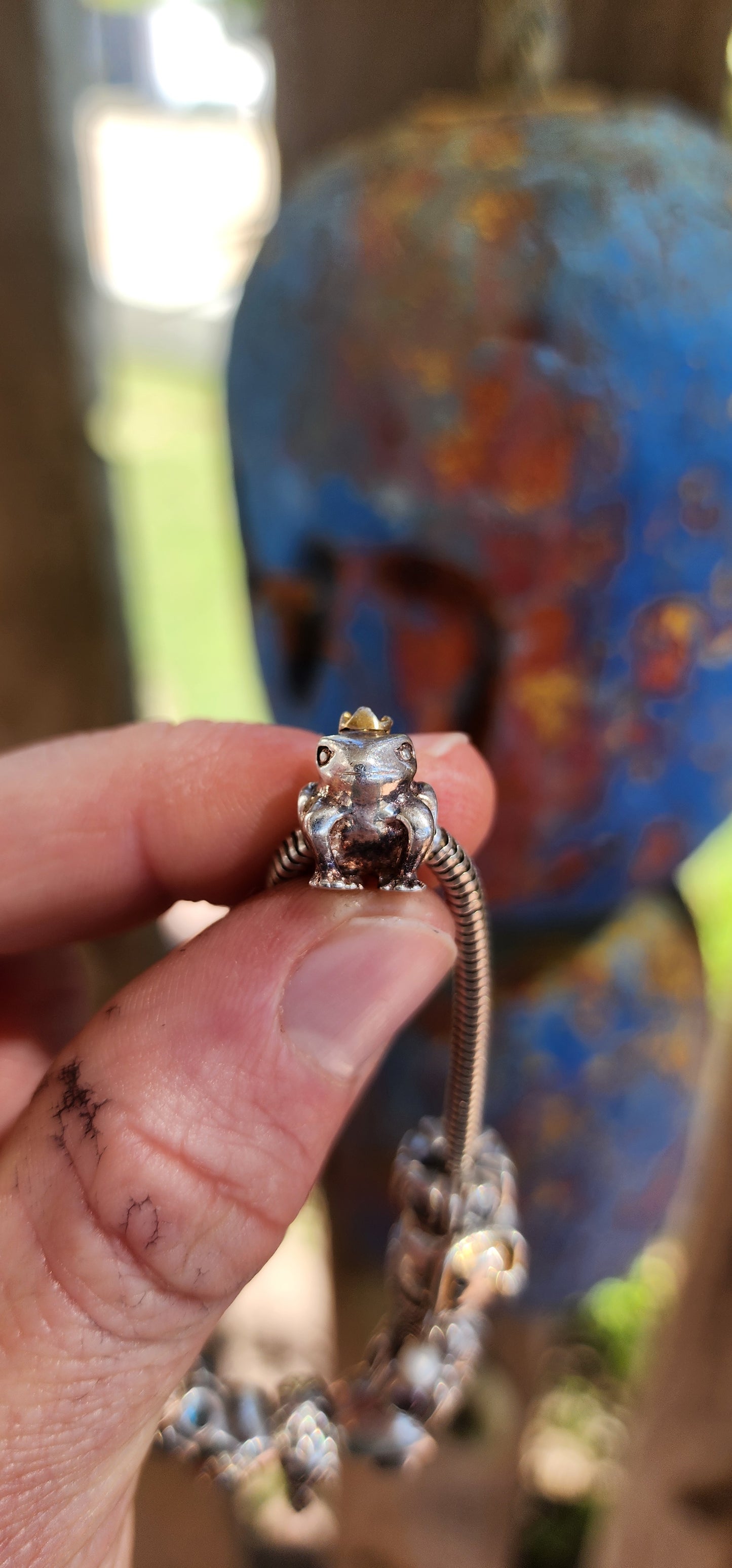 This delightful creation is a designer sterling silver snake chain charm bracelet by Donna Mia, brimming with character, sparkle, and storytelling.