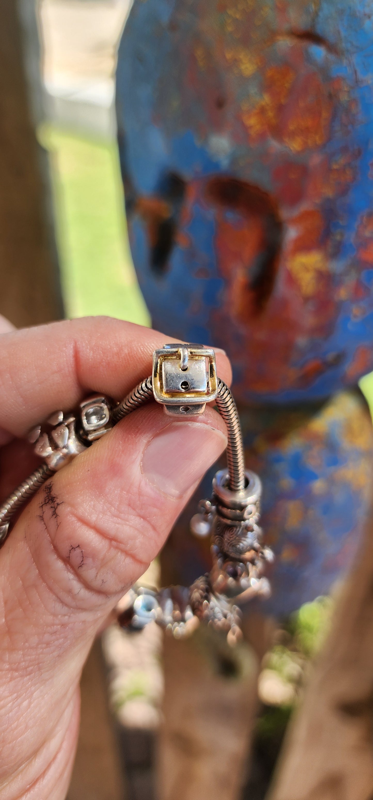 This delightful creation is a designer sterling silver snake chain charm bracelet by Donna Mia, brimming with character, sparkle, and storytelling.