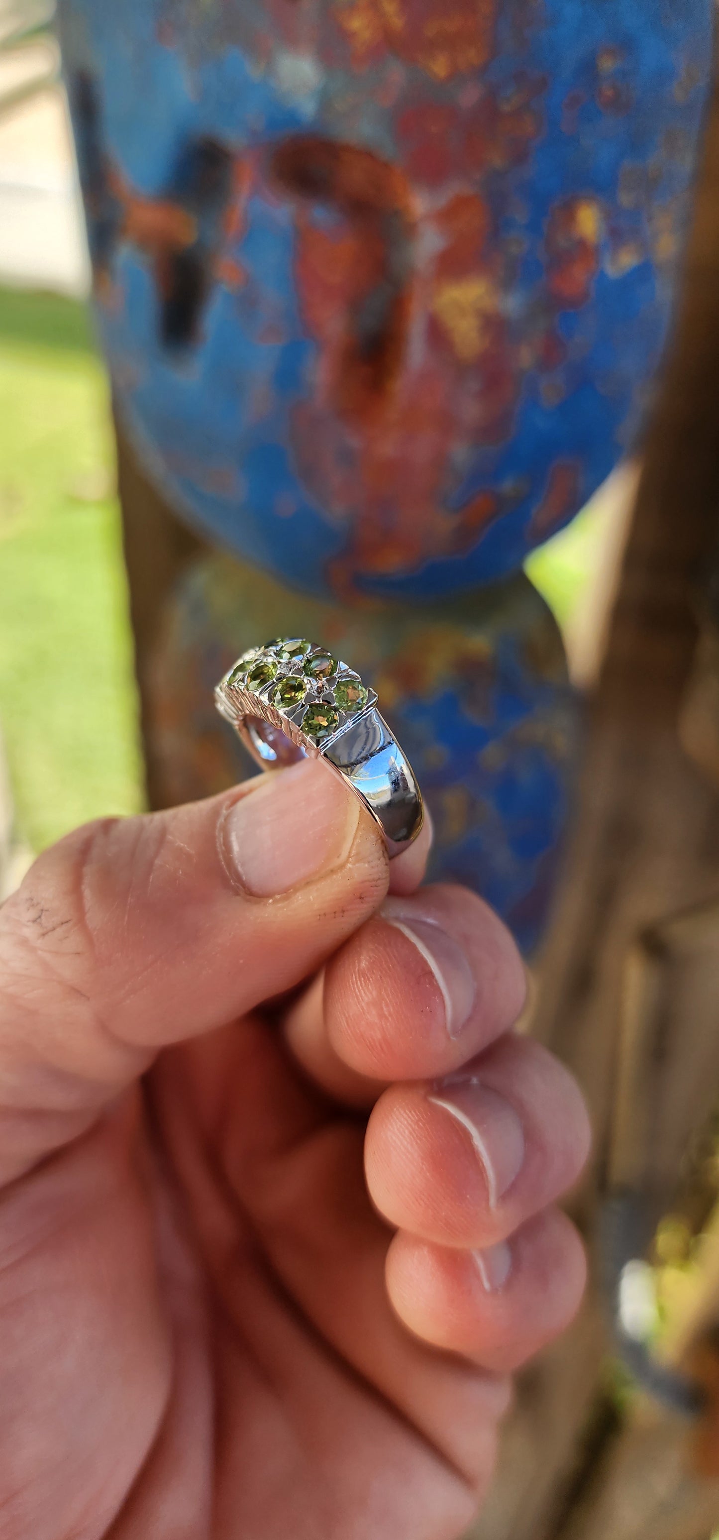 This chunky unisex half-eternity style ring is crafted in sterling silver and finished with a protective layer of rhodium plating for a bright, tarnish-resistant sparkle.