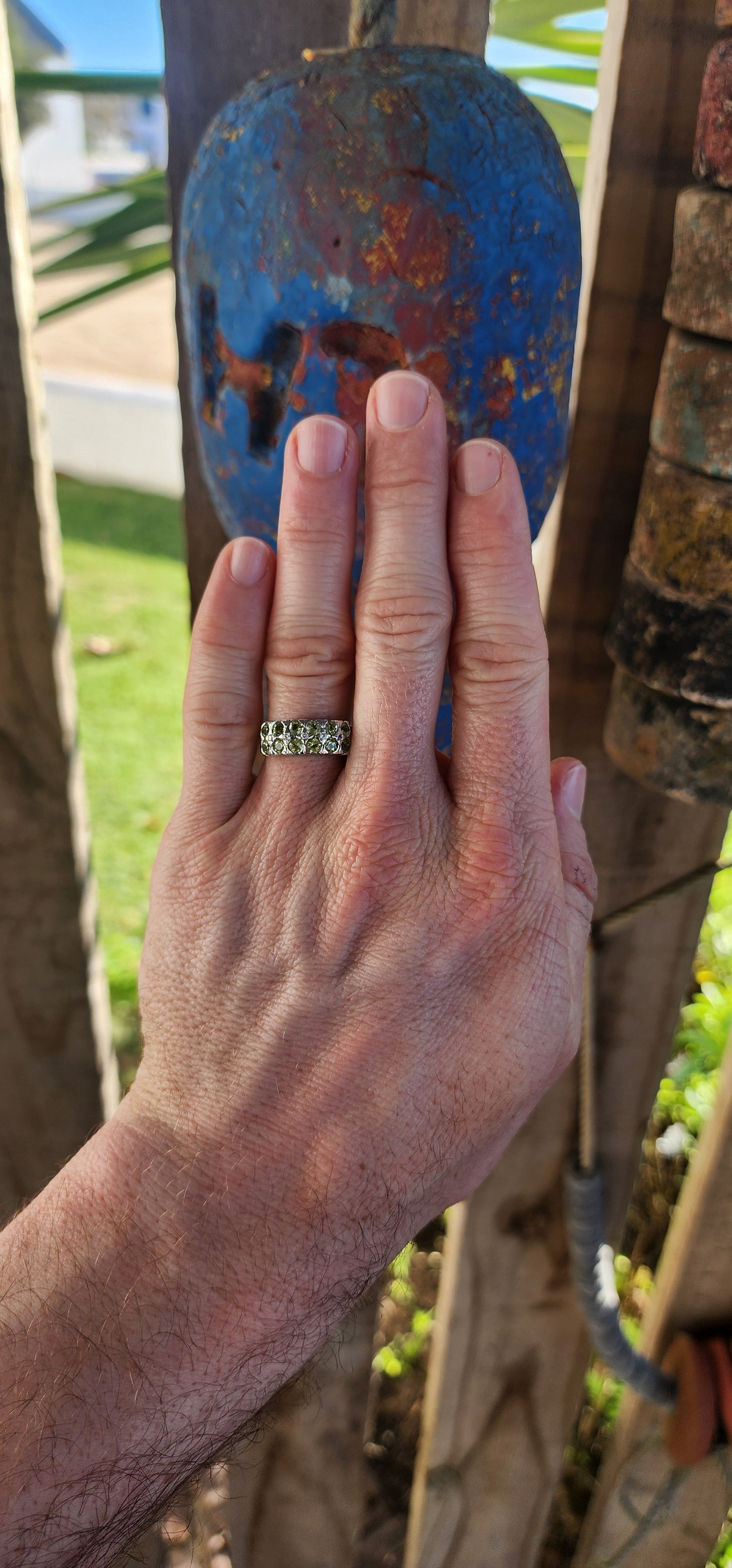 This chunky unisex half-eternity style ring is crafted in sterling silver and finished with a protective layer of rhodium plating for a bright, tarnish-resistant sparkle.