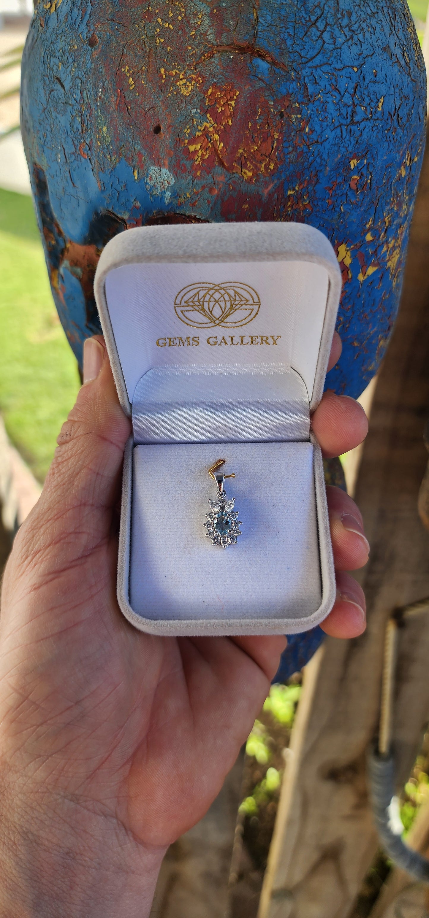 An enchanting treasure of elegance – this sterling silver and aquamarine floral halo pendant perfectly captures the essence of grace.