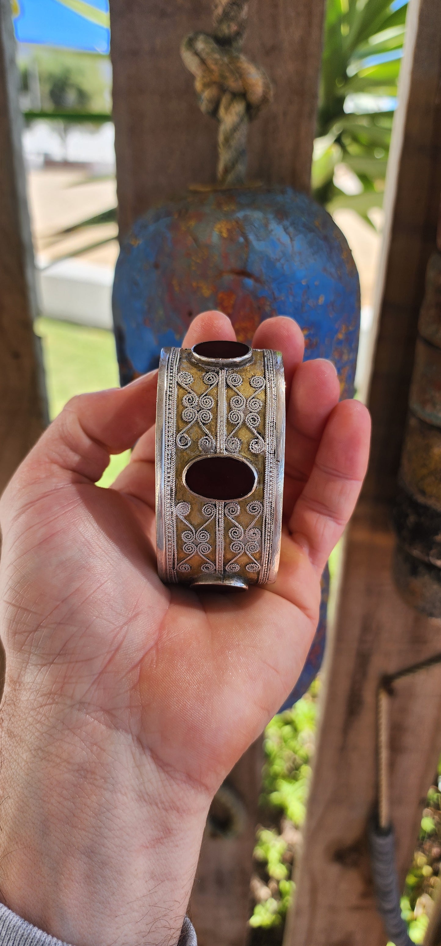 A striking and weighty solid sterling silver open cuff bangle, crafted by the nomadic Tekke tribe of Turkmenistan circa 1920s. This imposing piece embodies the opulence and symbolism of traditional ethnic Afghan/Turkoman adornment.