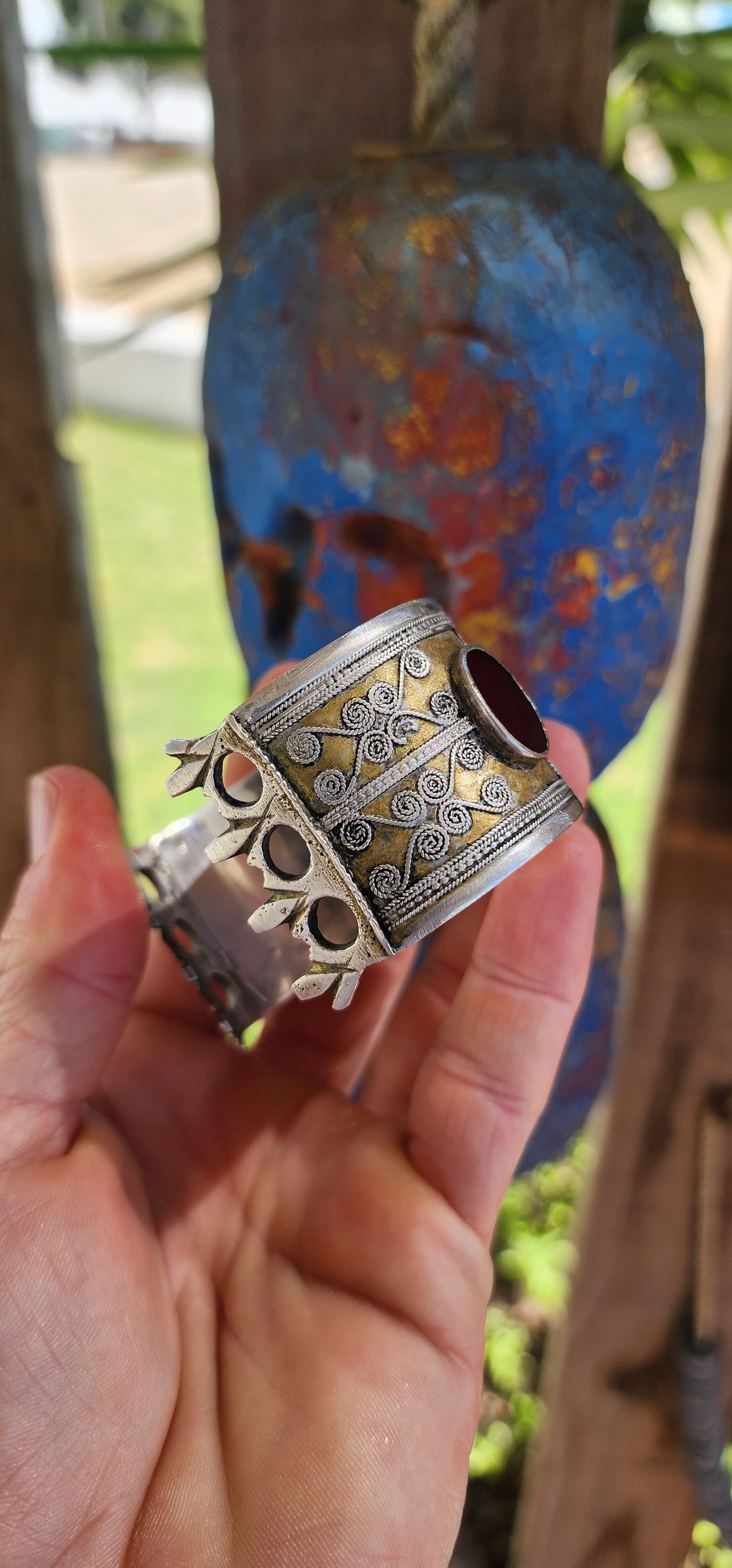 A striking and weighty solid sterling silver open cuff bangle, crafted by the nomadic Tekke tribe of Turkmenistan circa 1920s. This imposing piece embodies the opulence and symbolism of traditional ethnic Afghan/Turkoman adornment.