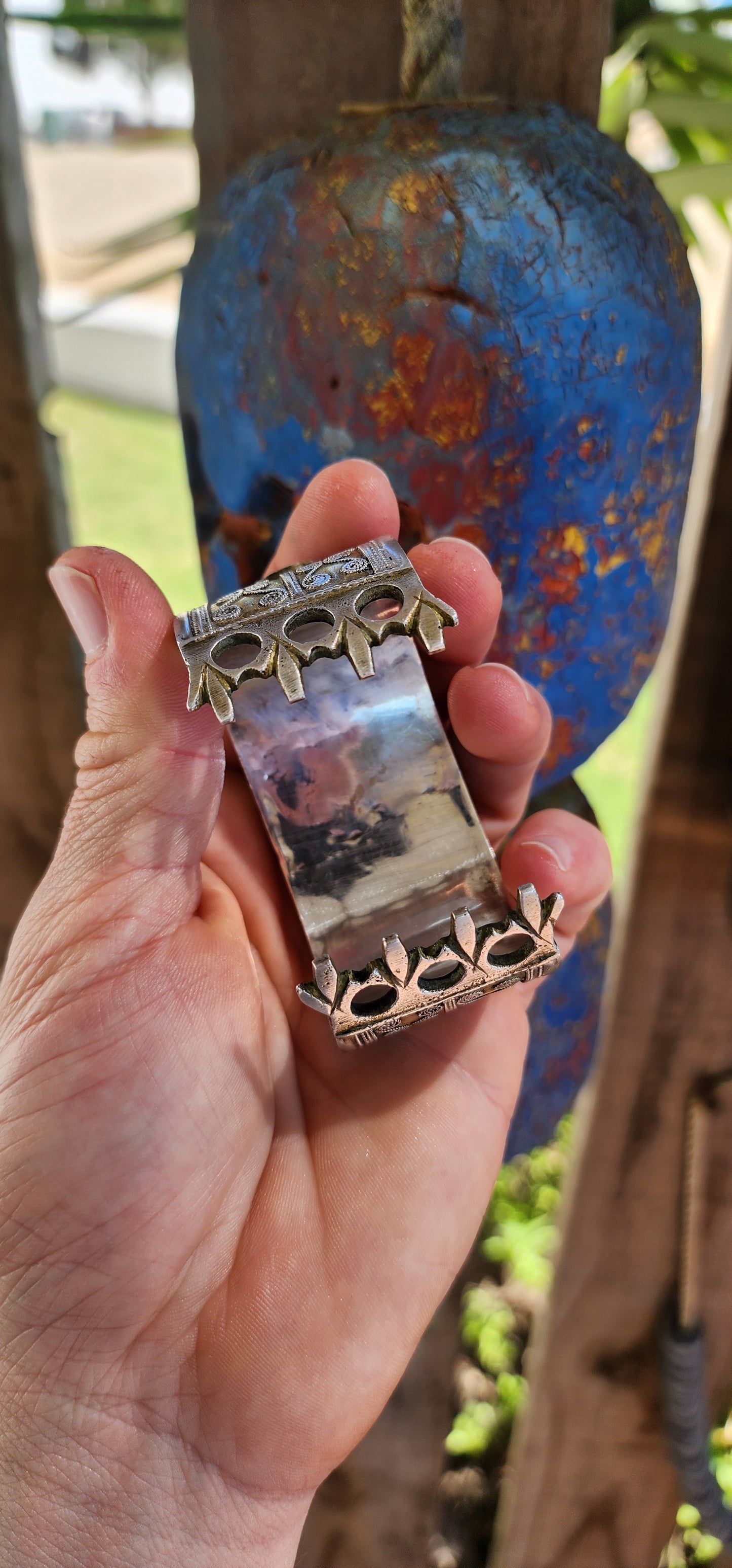A striking and weighty solid sterling silver open cuff bangle, crafted by the nomadic Tekke tribe of Turkmenistan circa 1920s. This imposing piece embodies the opulence and symbolism of traditional ethnic Afghan/Turkoman adornment.