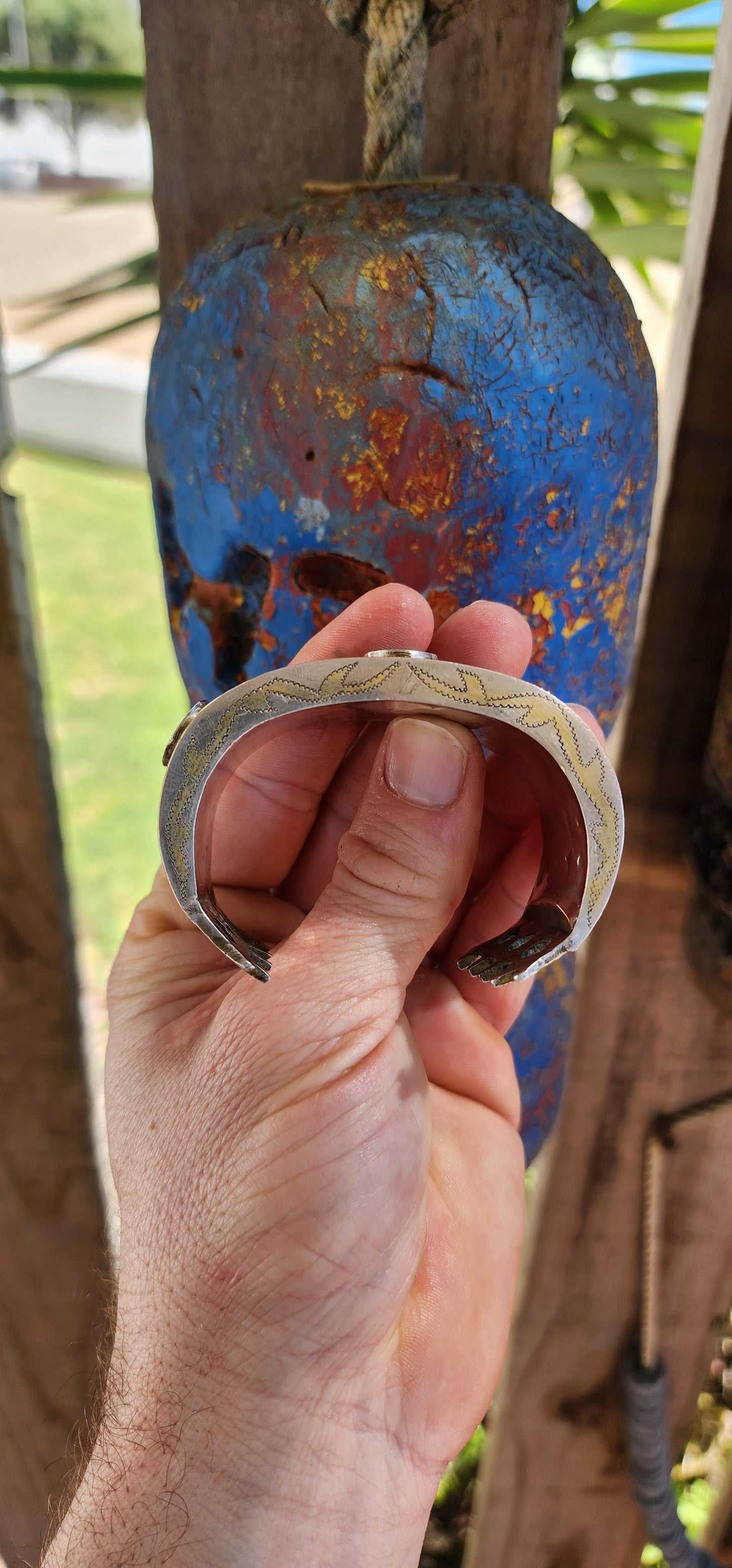 A striking and weighty solid sterling silver open cuff bangle, crafted by the nomadic Tekke tribe of Turkmenistan circa 1920s. This imposing piece embodies the opulence and symbolism of traditional ethnic Afghan/Turkoman adornment.