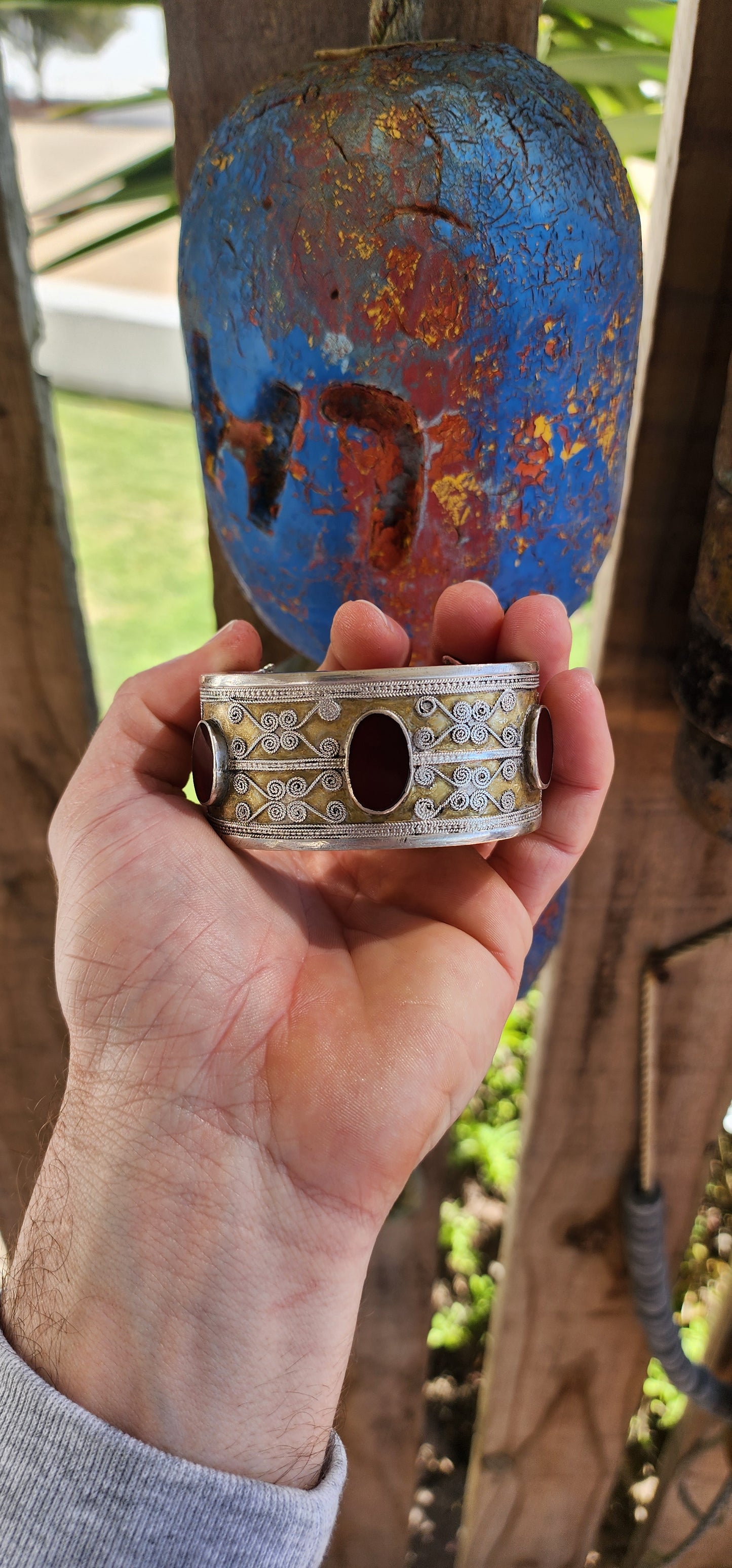 A striking and weighty solid sterling silver open cuff bangle, crafted by the nomadic Tekke tribe of Turkmenistan circa 1920s. This imposing piece embodies the opulence and symbolism of traditional ethnic Afghan/Turkoman adornment.