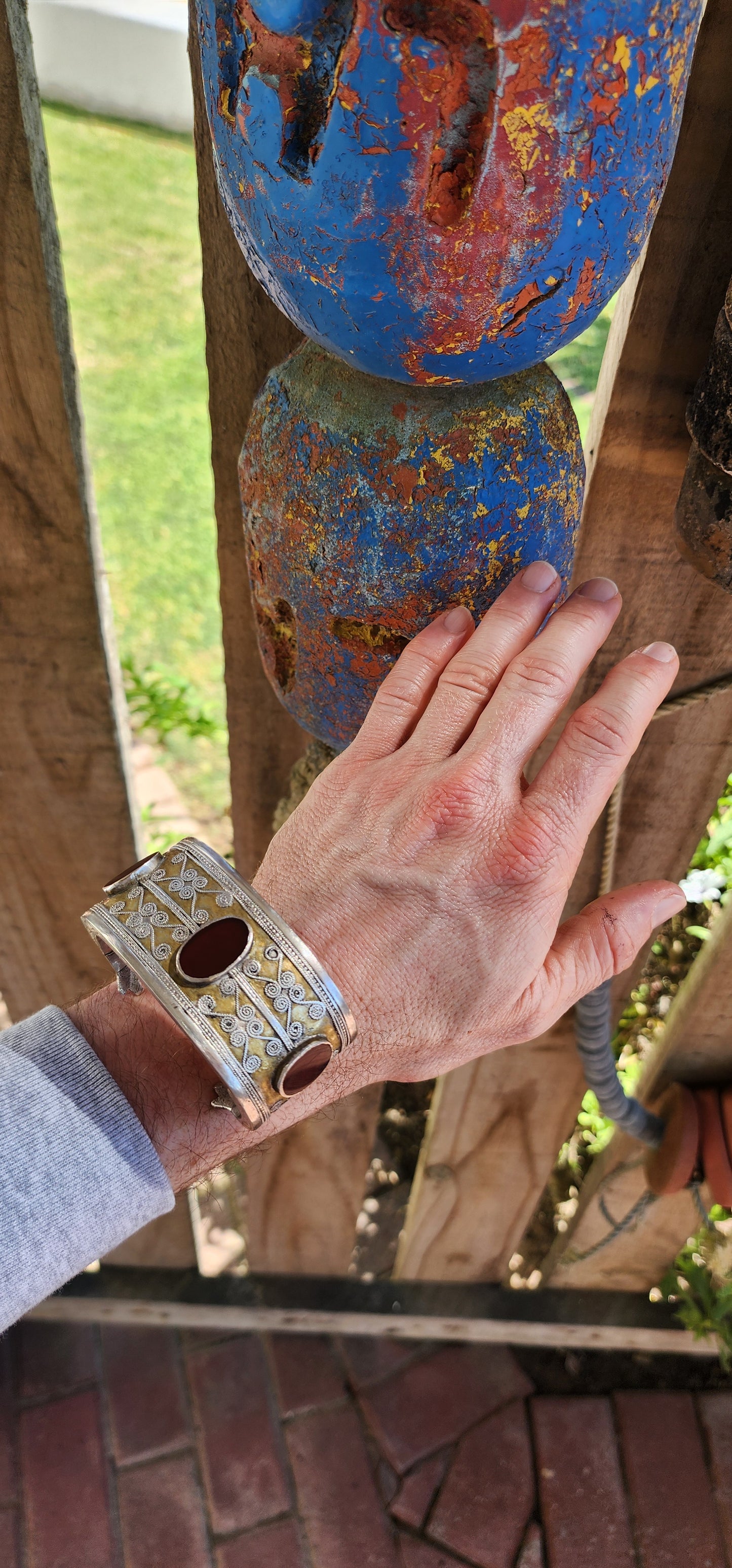 A striking and weighty solid sterling silver open cuff bangle, crafted by the nomadic Tekke tribe of Turkmenistan circa 1920s. This imposing piece embodies the opulence and symbolism of traditional ethnic Afghan/Turkoman adornment.