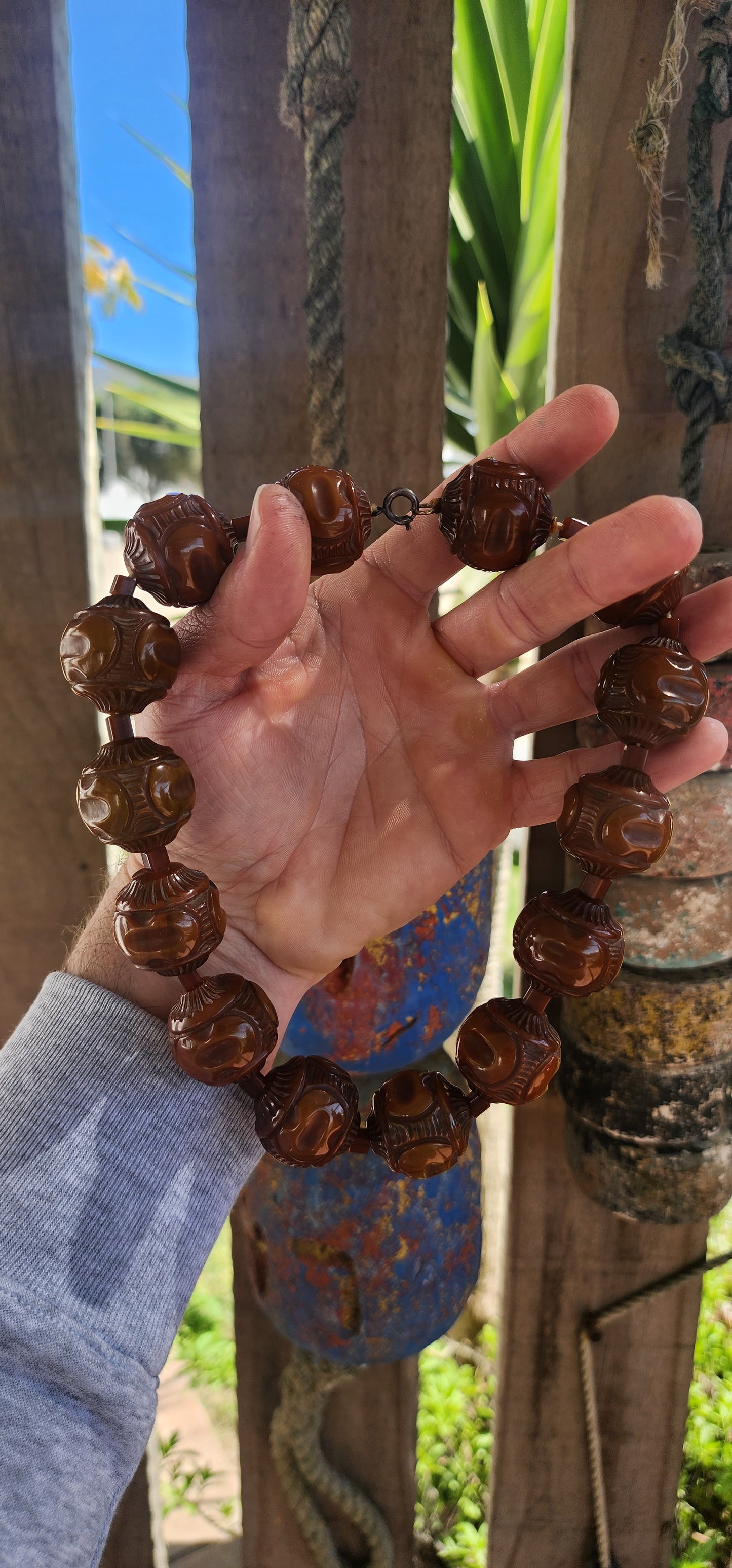 An extraordinary Art Deco-era 1920s carved Bakelite beaded choker necklace that embodies the bold glamour of its age.