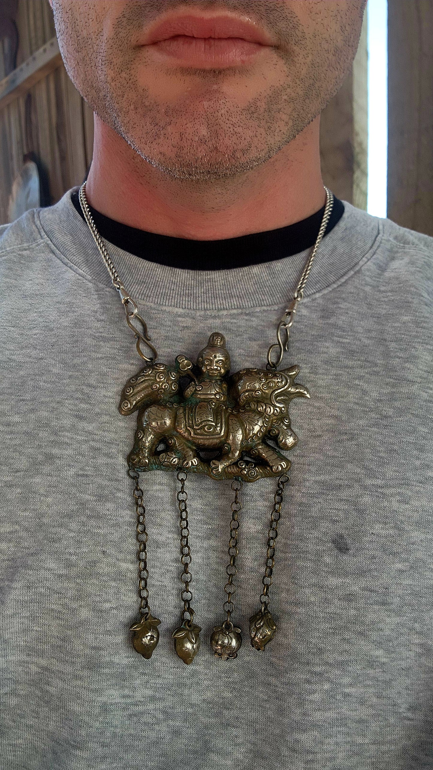 Oversized Antique Chinese Silvertone Pendant Depicting a Warrior on a Qilin with Longevity Charms.