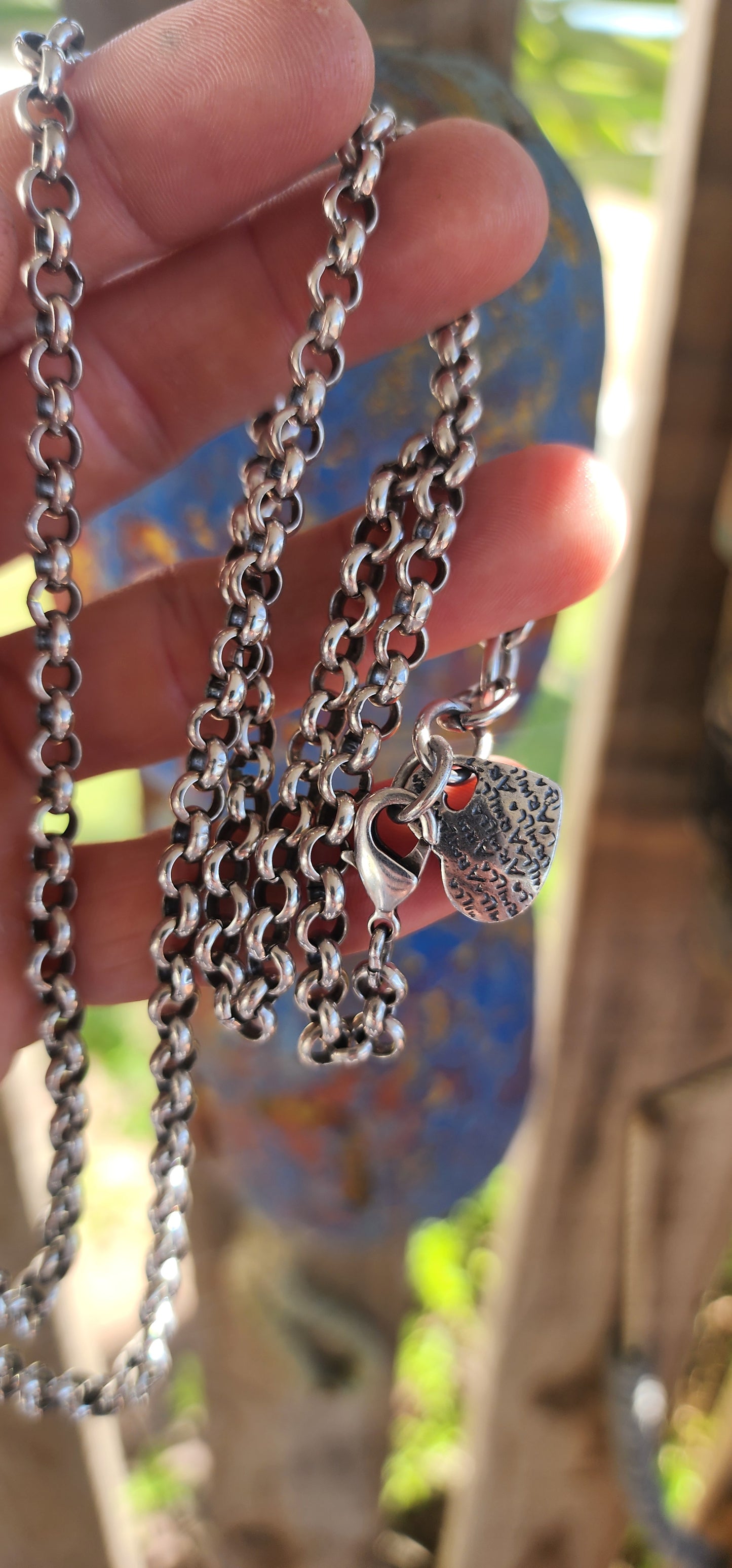Up for grabs is this extra-length silver-plated rolo link necklace, an early creation by the renowned local designer Armilla.