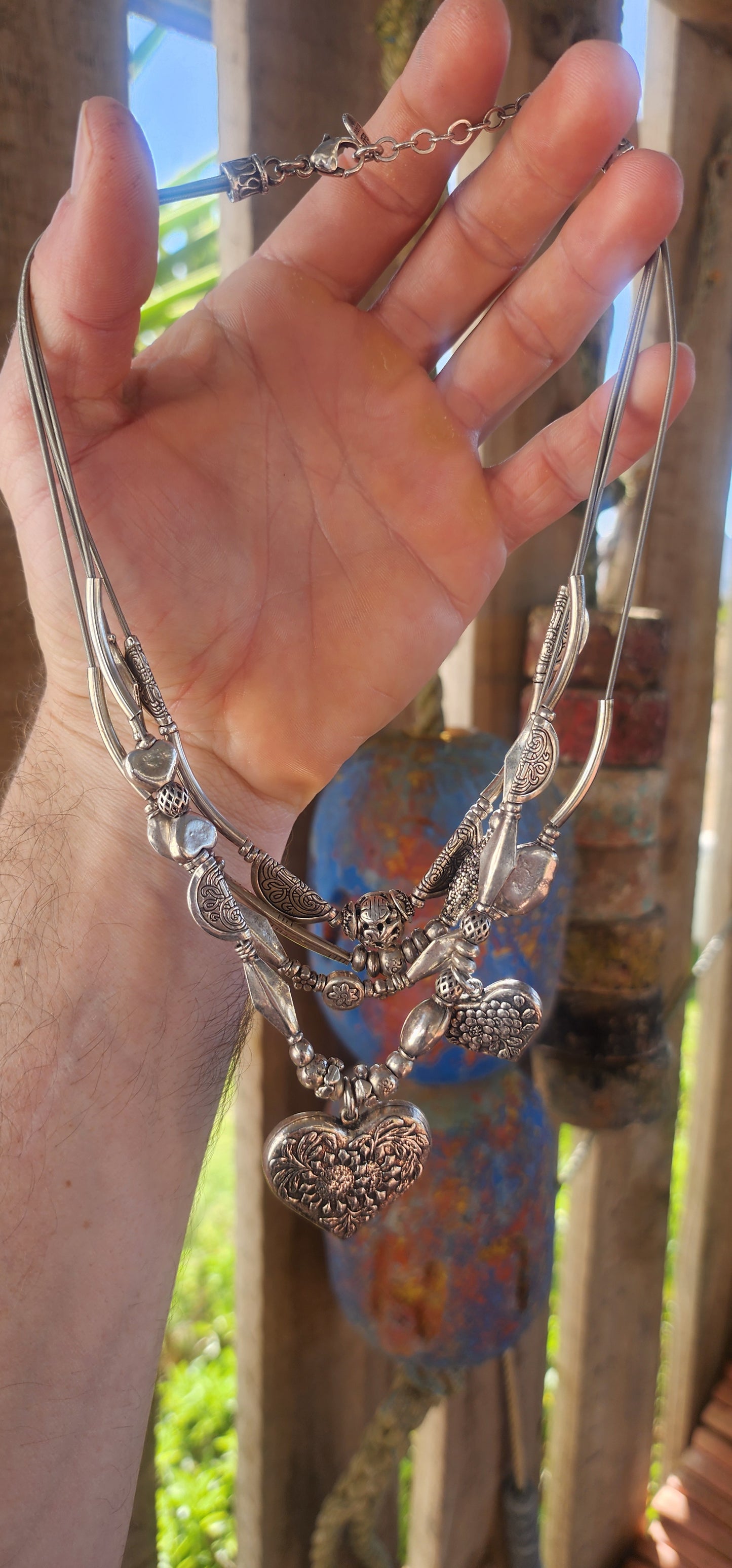 This chunky designer multi-strand heart necklace by Gas Bijoux is a bold and romantic statement piece that perfectly embodies the brand’s signature blend of bohemian luxury and Parisian sophistication.