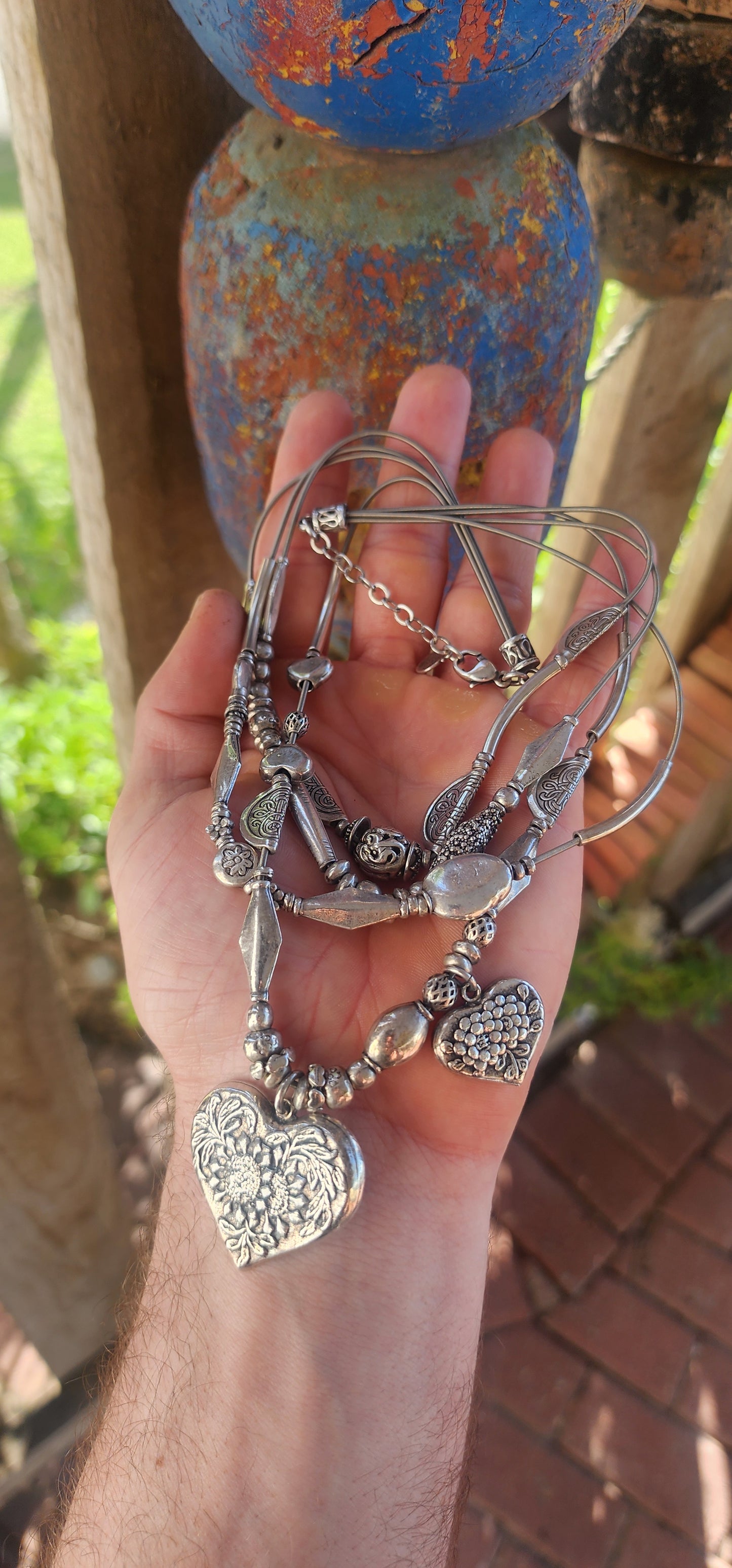 This chunky designer multi-strand heart necklace by Gas Bijoux is a bold and romantic statement piece that perfectly embodies the brand’s signature blend of bohemian luxury and Parisian sophistication.