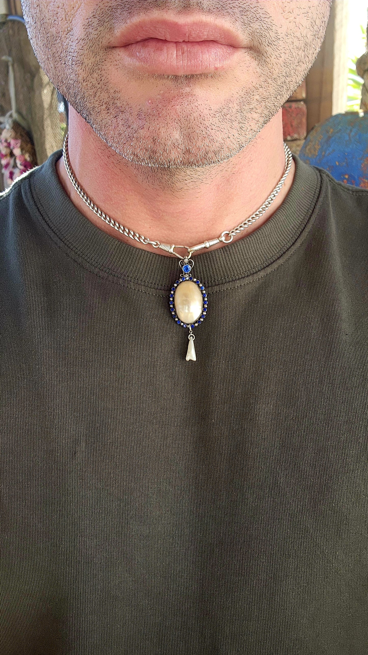 A breathtaking antique Art Nouveau / Jugendstil pendant dating to the early 1900s, exquisitely crafted in sterling silver with all the hallmarks of the romantic and nature-inspired design language that defined the period.