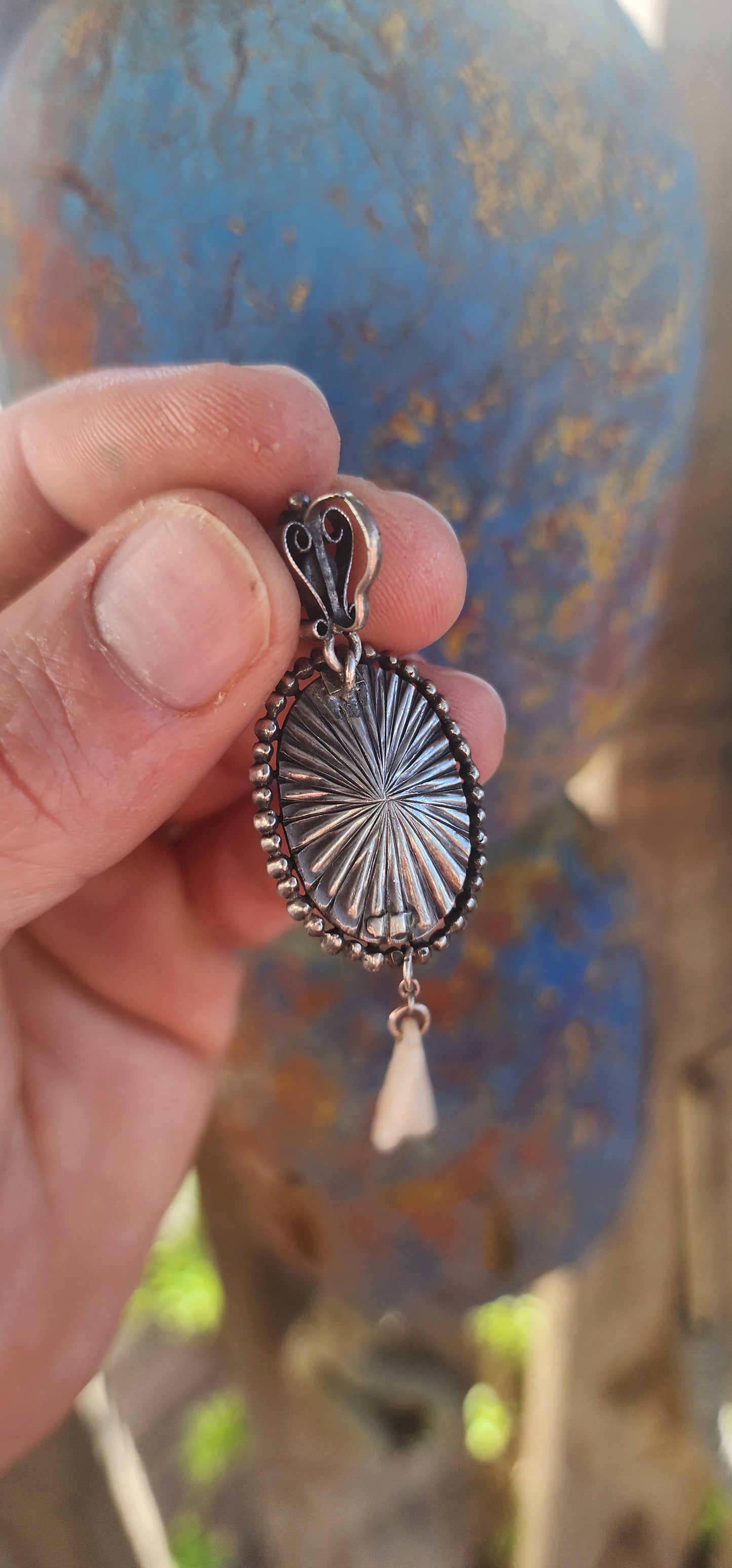 A breathtaking antique Art Nouveau / Jugendstil pendant dating to the early 1900s, exquisitely crafted in sterling silver with all the hallmarks of the romantic and nature-inspired design language that defined the period.