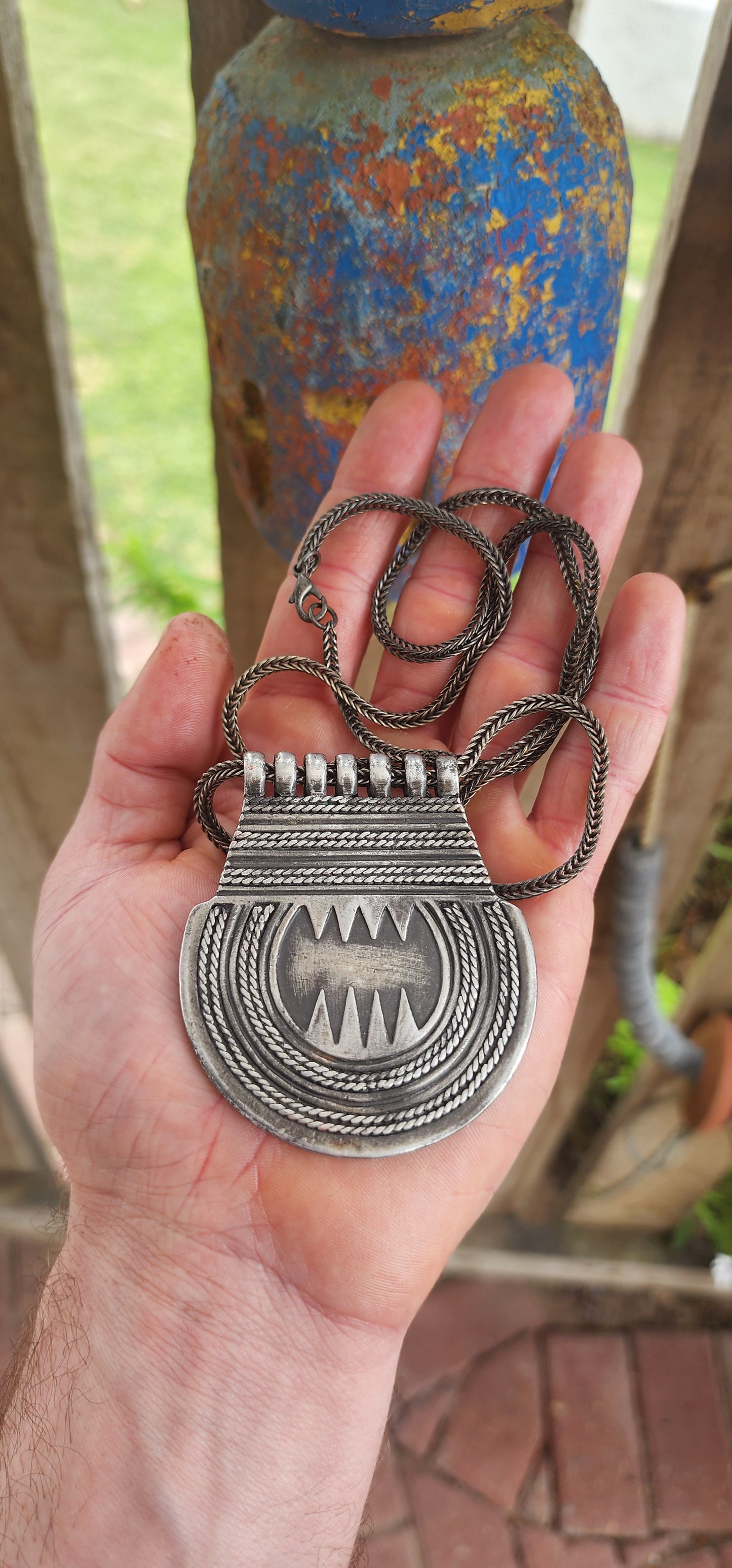 Marvelous vintage ethnic Saharan Berber Tuareg pendant necklace, exquisitely handcrafted in silver plate and suspended from an extra-length woven foxtail chain.