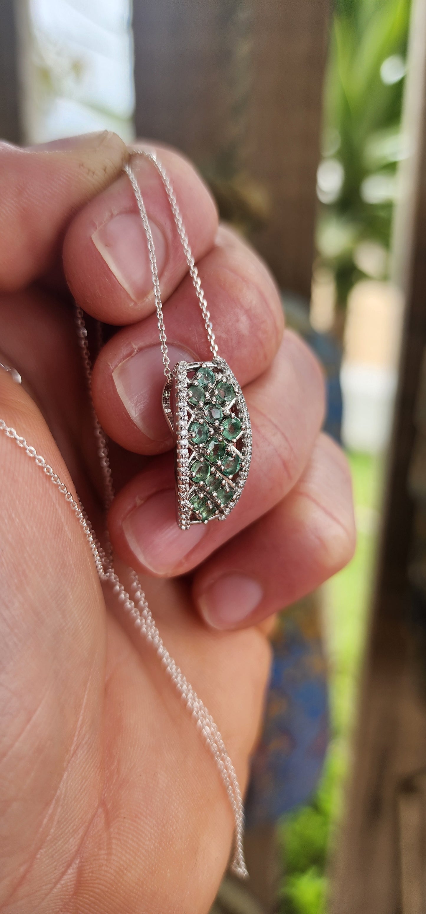 Exquisite Art Deco Revival sterling silver pendant on a fine, adjustable-length chain.