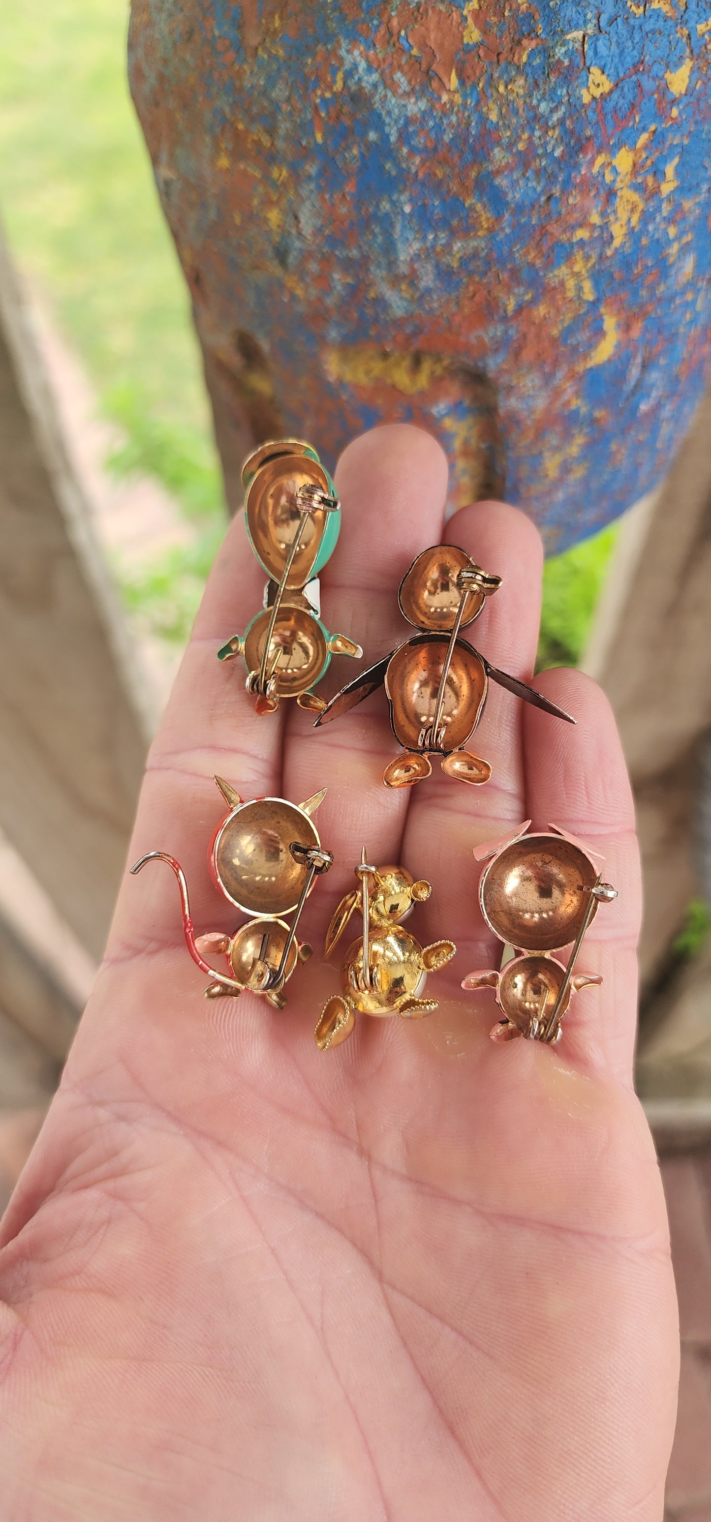 Playful collection of 5x Art Deco–era circa 1920s–1930s novelty brooches, crafted in copper with hand-painted enamel details that burst with vintage charm and personality.