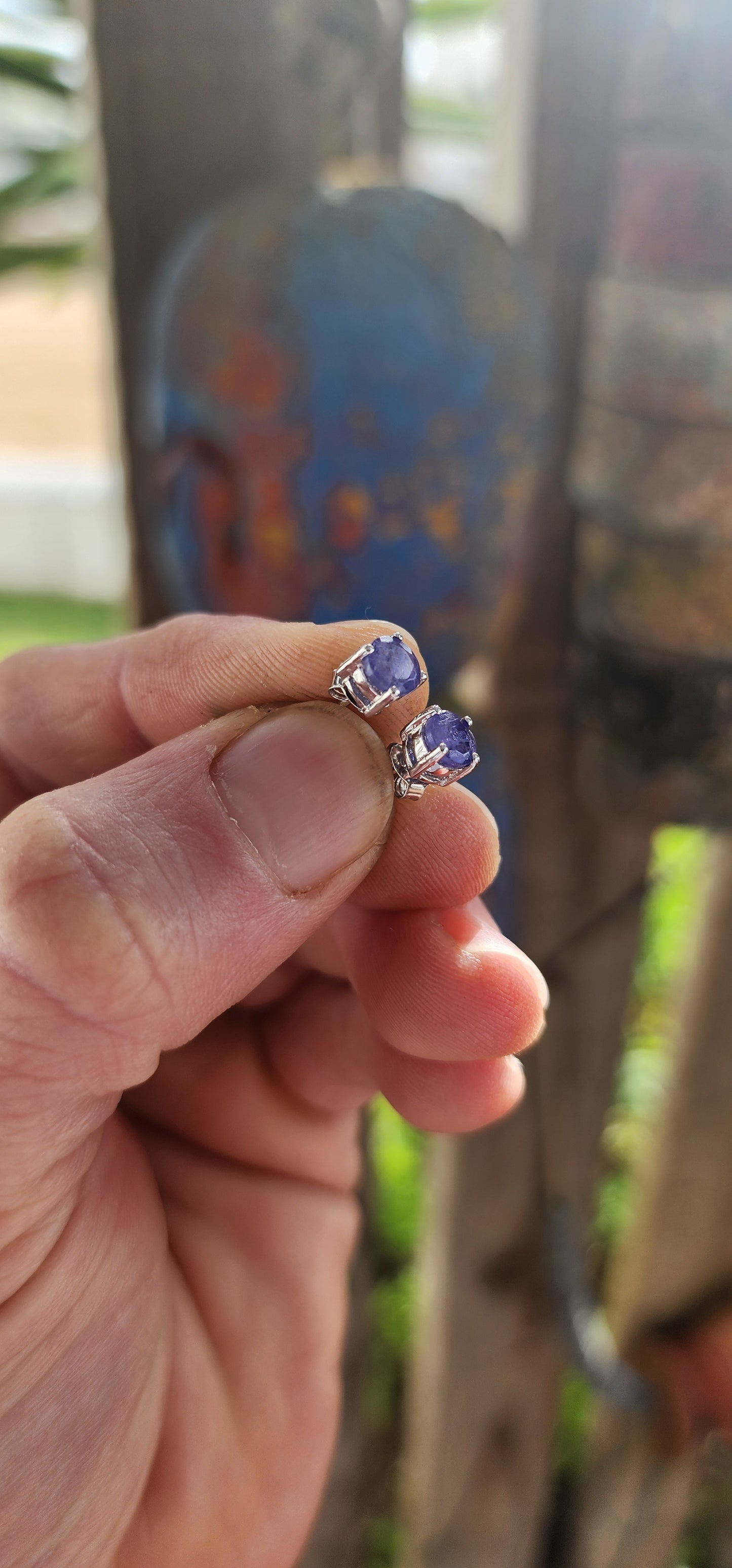 Small in size but rich in presence, these sterling silver stud earrings are a refined nod to nature’s twilight palette.