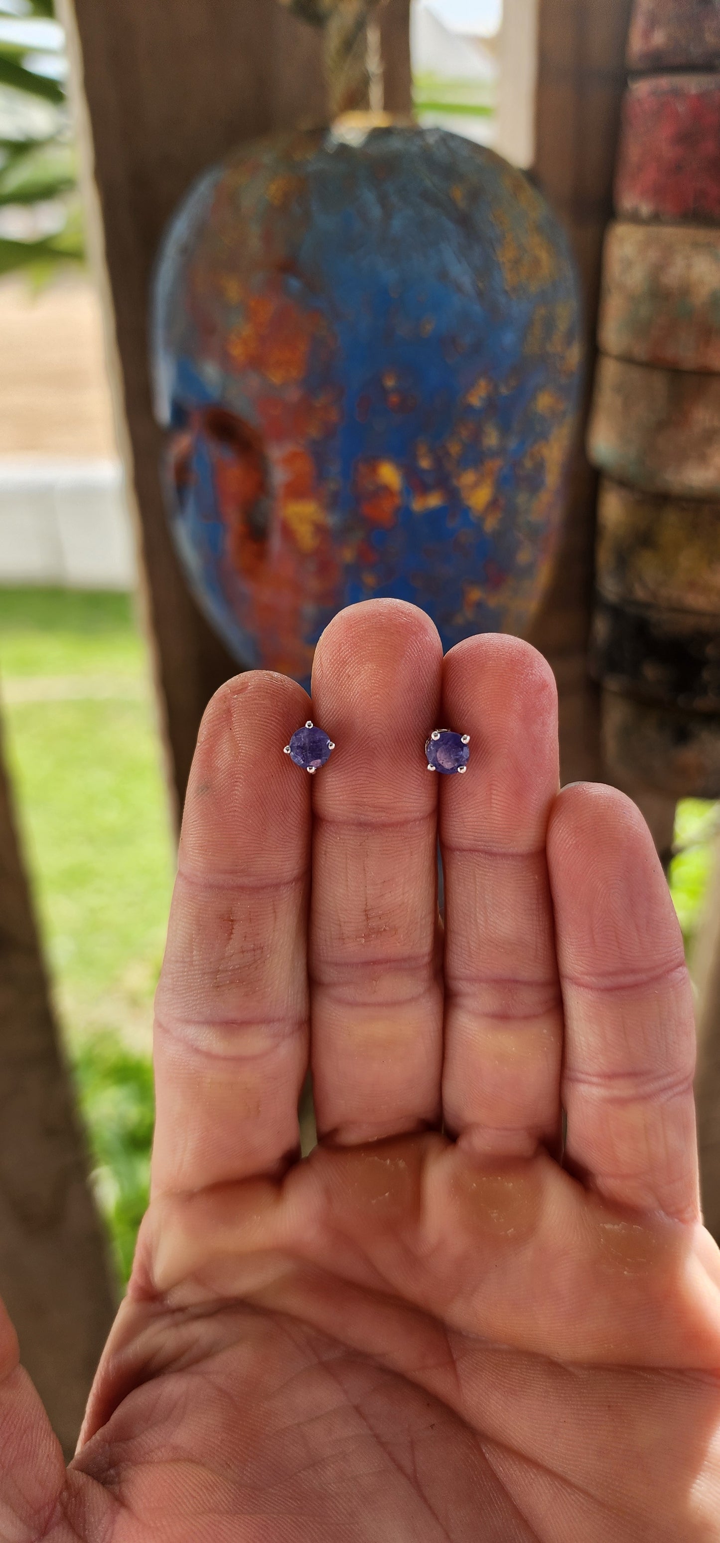 Small in size but rich in presence, these sterling silver stud earrings are a refined nod to nature’s twilight palette.