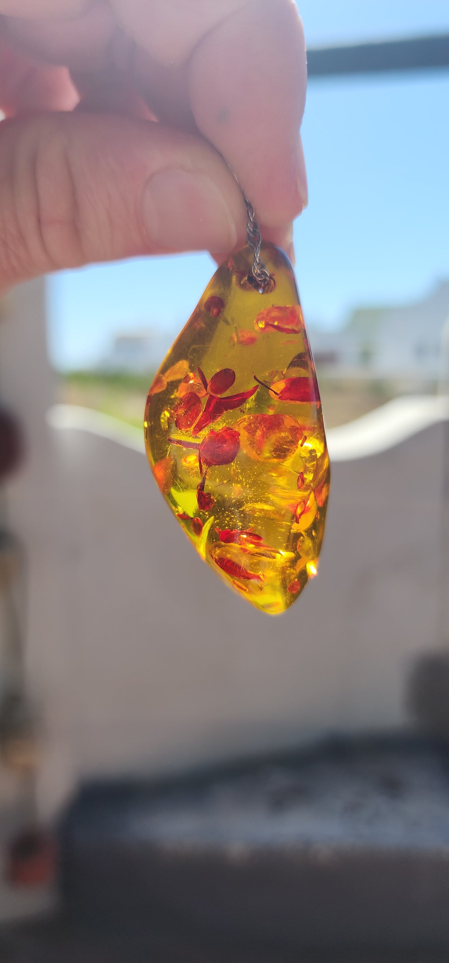 Magnificent and luminous, this large Baltic “piebald” amber pendant glows like captured sunlight!
