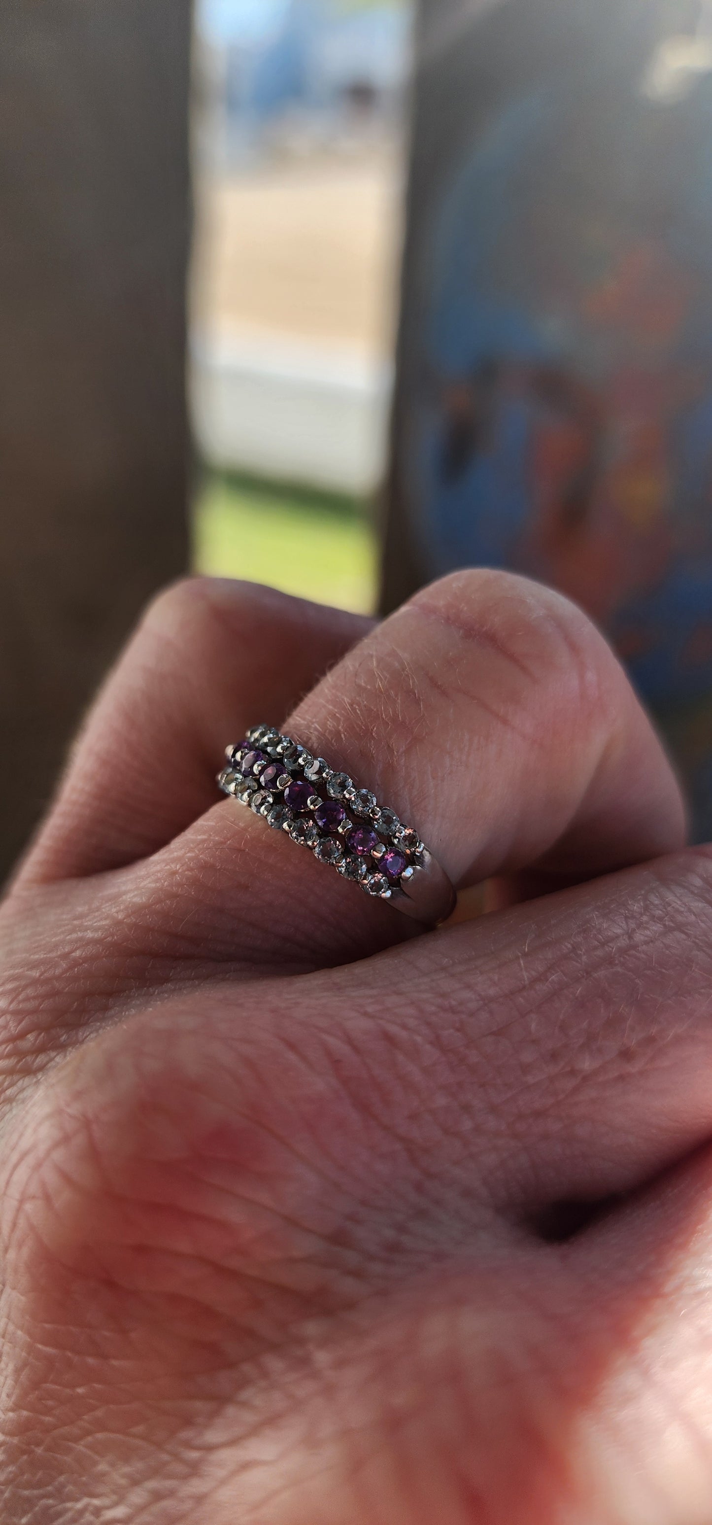 A beautifully balanced sterling silver 3-row half-eternity ring.