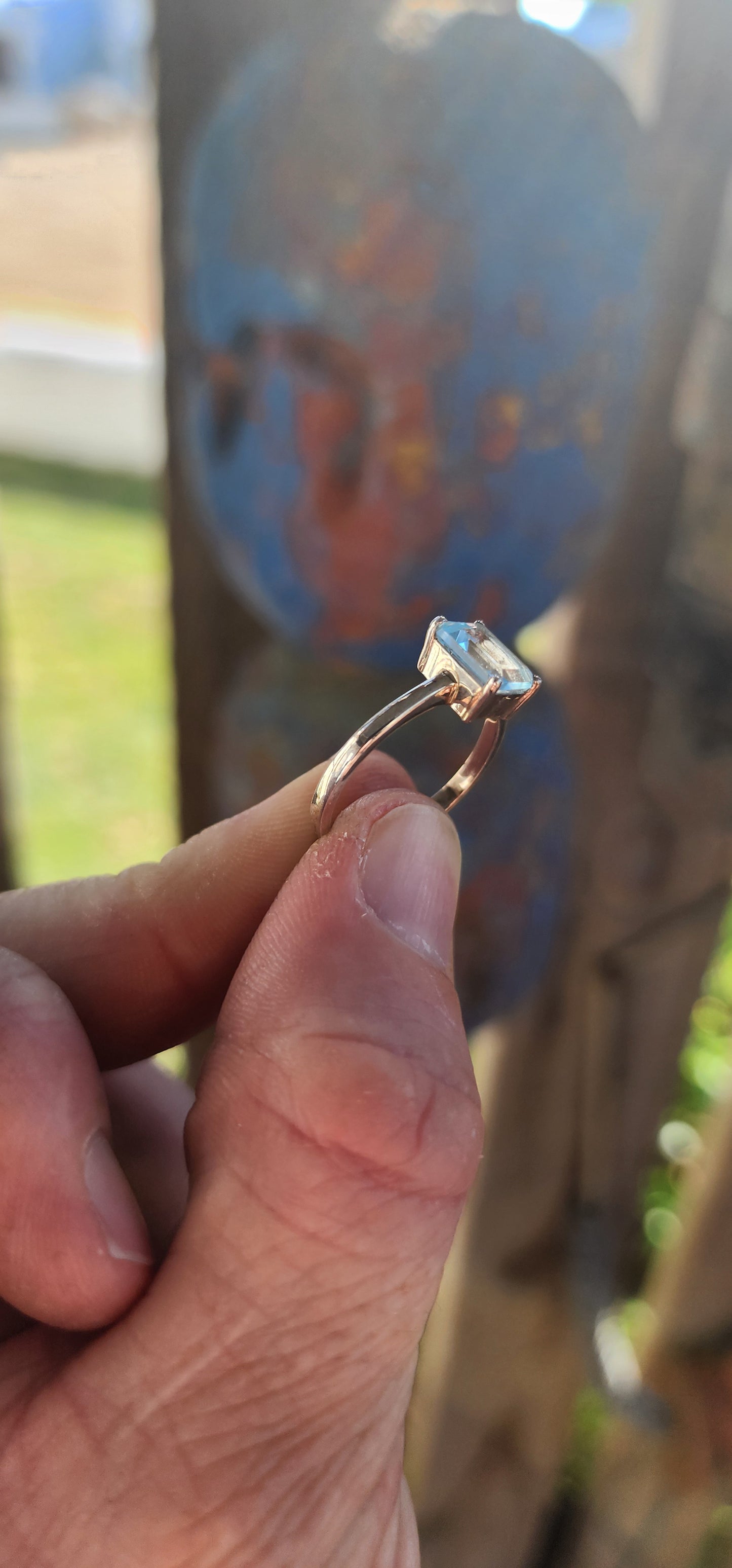Beautifully crafted sterling silver solitaire ring.
At its heart lies a captivating emerald-cut sky blue topaz, held securely in a four-prong raised basket.