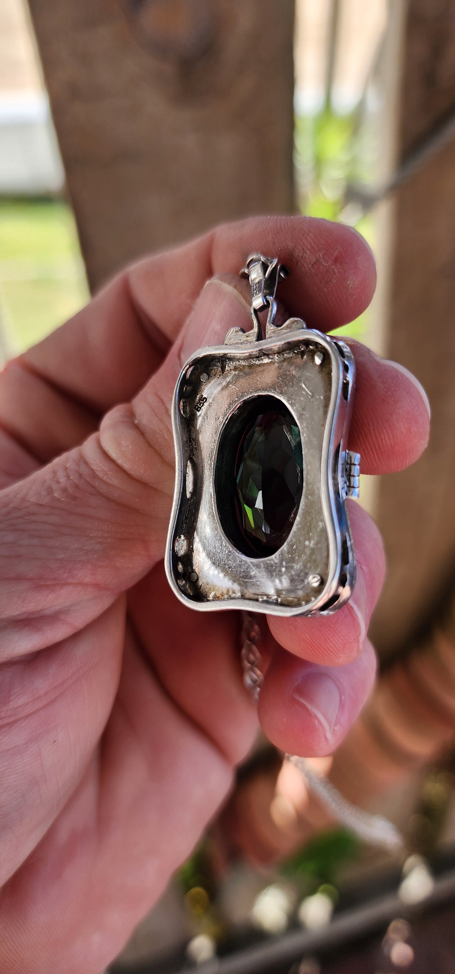 A magnificent step-back into the golden age of glamour, this rare and generous Art Deco pendant is a true showpiece—richly detailed, architecturally sculpted, and brimming with Old-World mystique.