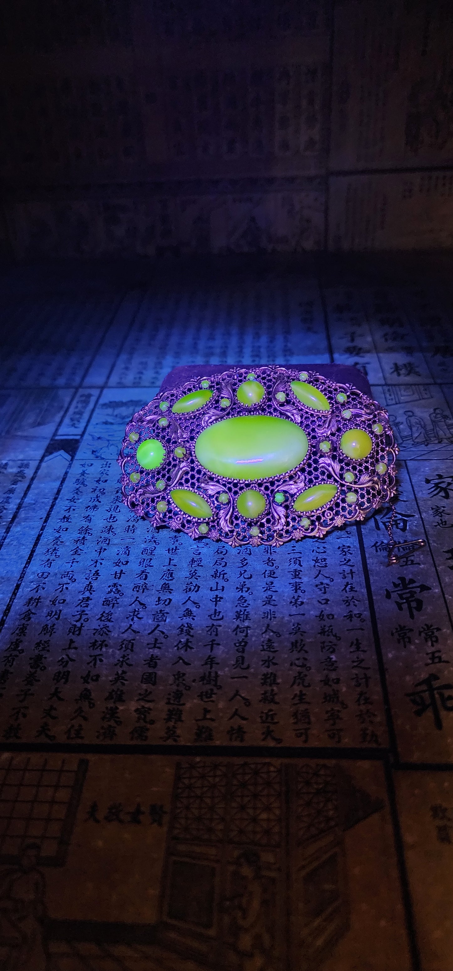 Prepare yourself, because this is not your average Czech brooch — this is a monumental 1920s Art Deco Czech masterpiece, an oversized, opulent explosion of filigree work and uranium satin glass.