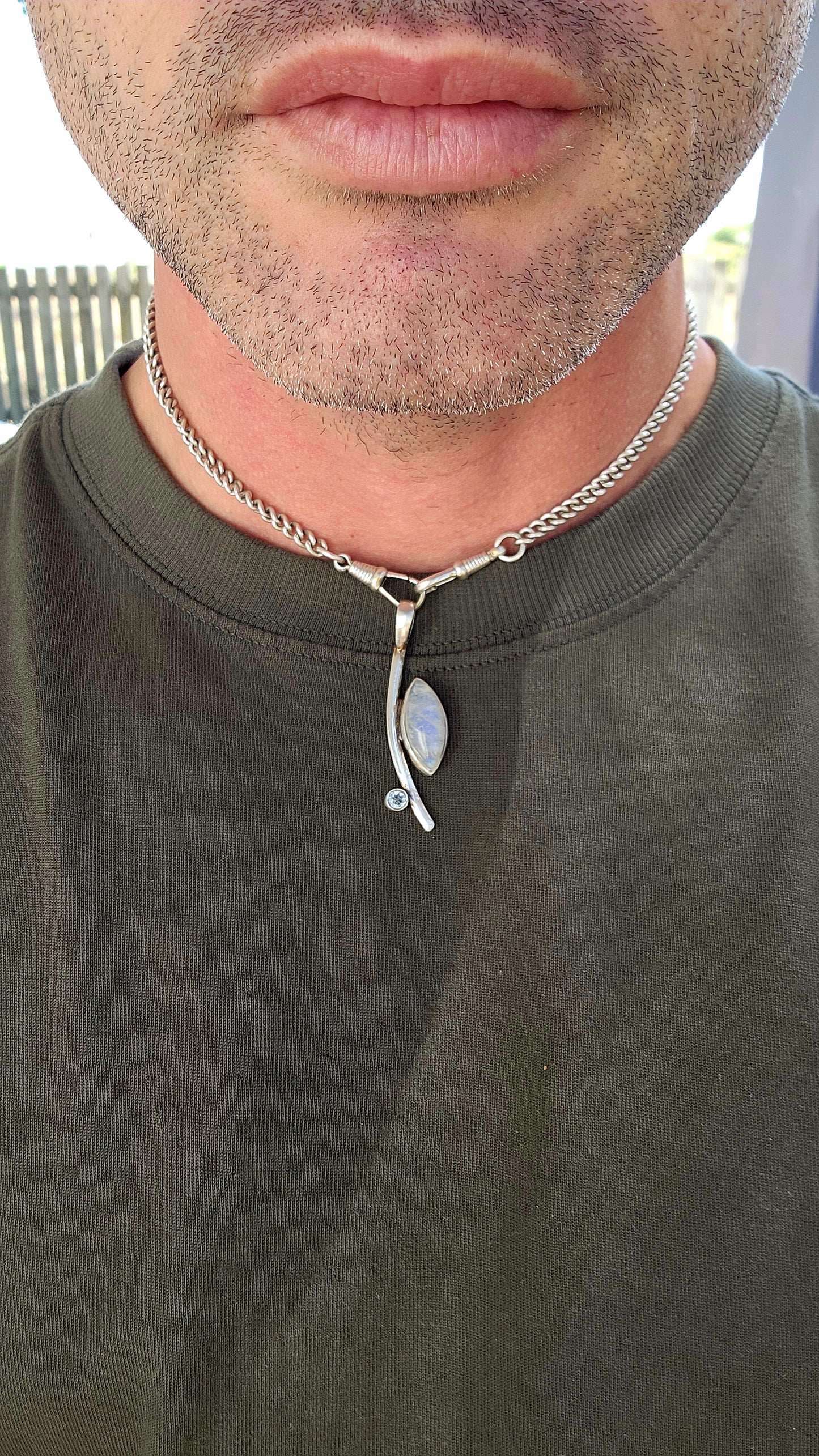 Here we have a sleek, contemporary artisan-made sterling silver pendant that brings all the modernist gallery vibes with a dash of celestial sparkle.