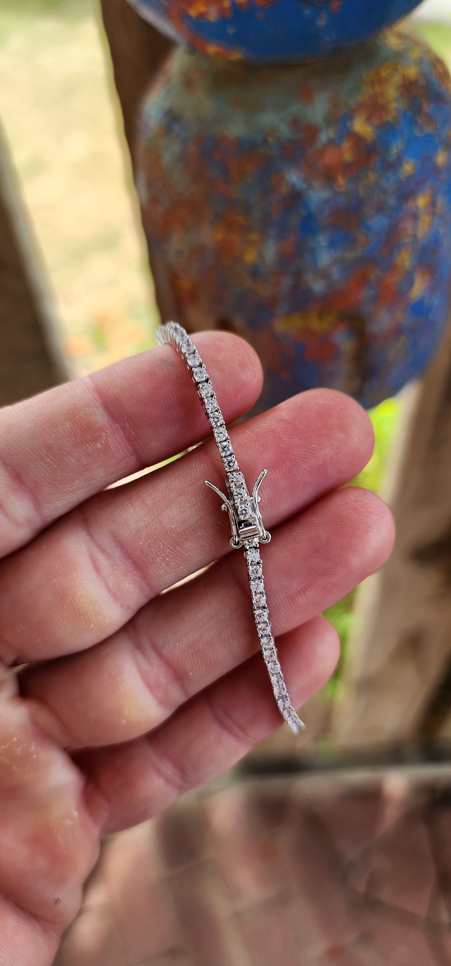 This sterling silver tennis bracelet is all about effortless sparkle and classical style. It features a stunning lineup of 74 small round-cut AAA Swiss-grade cubic zirconia gemstones.